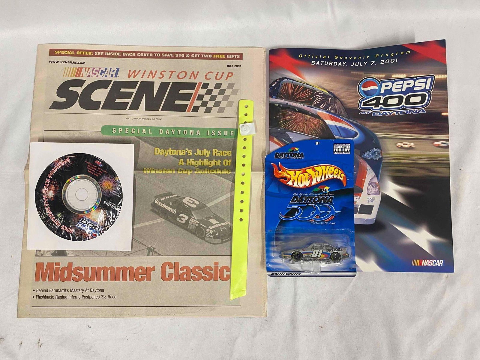 Official 2001 Daytona 500 Pepsi 400 Program - CD - Hotwheels - Scene Newspaper - Armband: This lot contains all items shown in the photographs. A complete list is shown below. The 2001 Daytona 500 was Dale Earnhardt's last race. The Pepsi 400 was the first race held after Dal