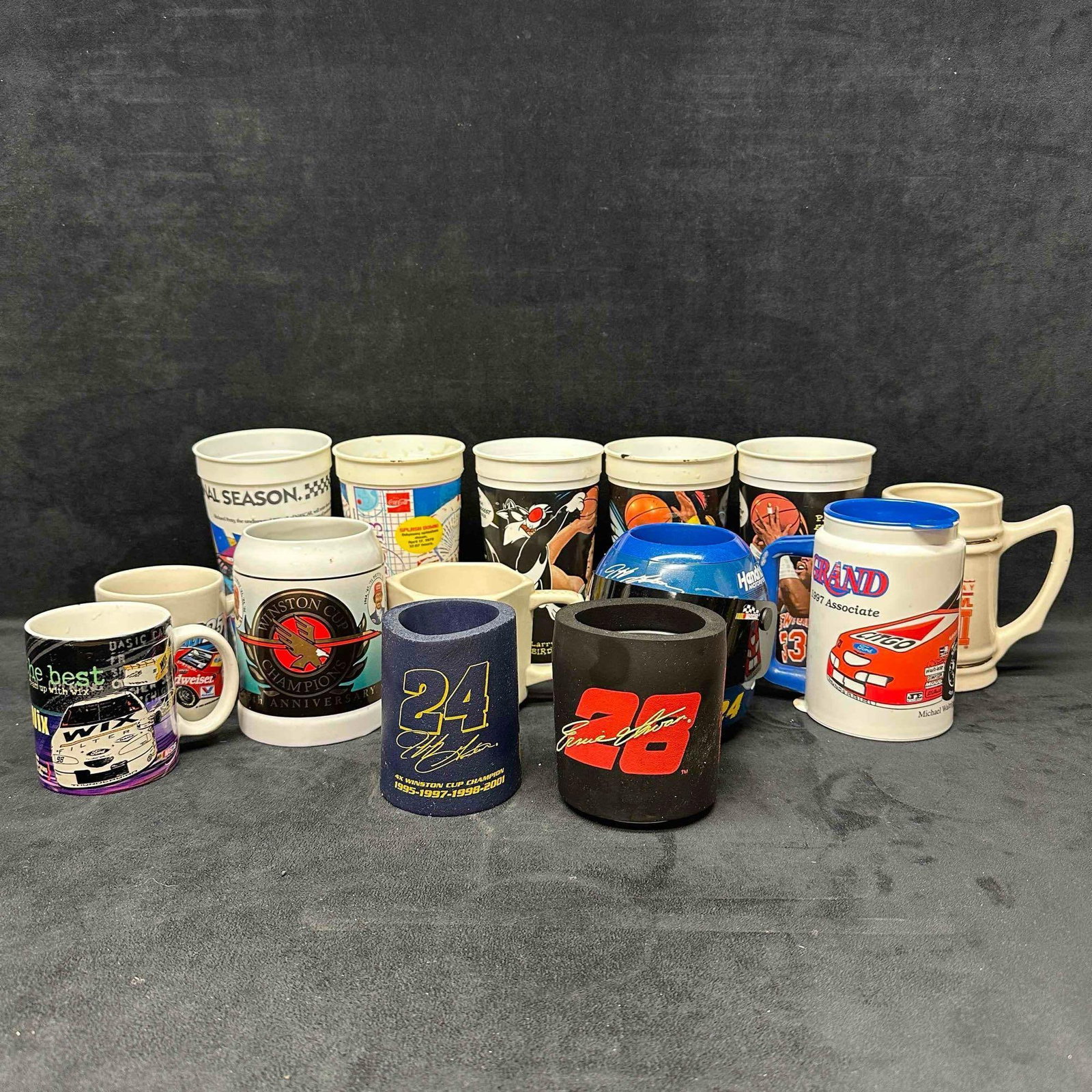 NASCAR Basketball Football Mug Cup Koozie Set Jeff Gordon Helmet: Several sport souvenir included in this set from mug, can holder, and other cups. NASCAR, NBA, NFL, and movie entertainment souvenirs. Several NASCAR driver's represented such as Jeff Gordon. Thes
