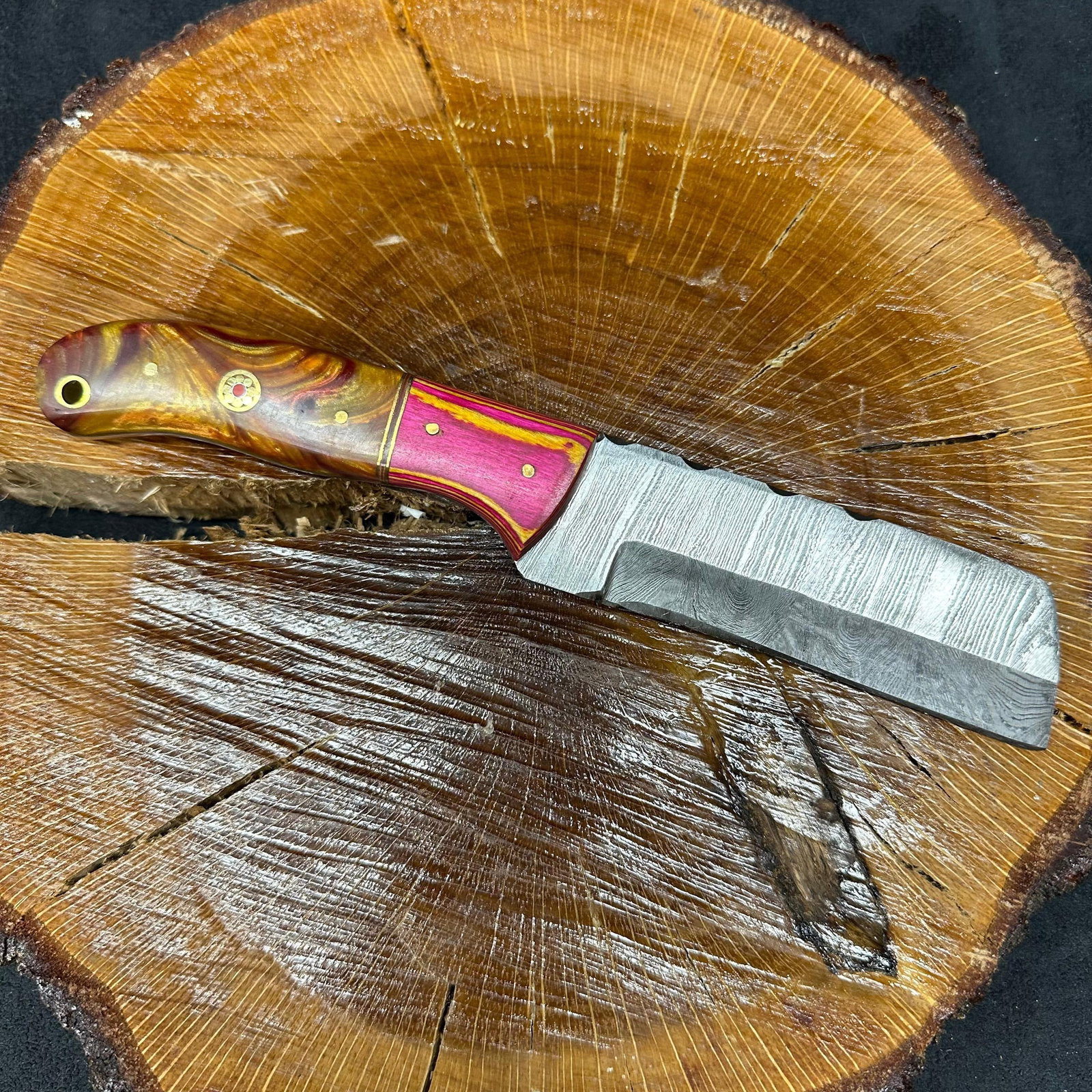 Multi Colorway Design Handle MHS Cutlery Knife Cleaver Style Blade P87: Fixed small, cleaver-style blade knife by MHS Cutlery featuring a layered patterned steel straight back blade and decorative spine work. The handle features a contoured, wood/epoxy resin-style gr