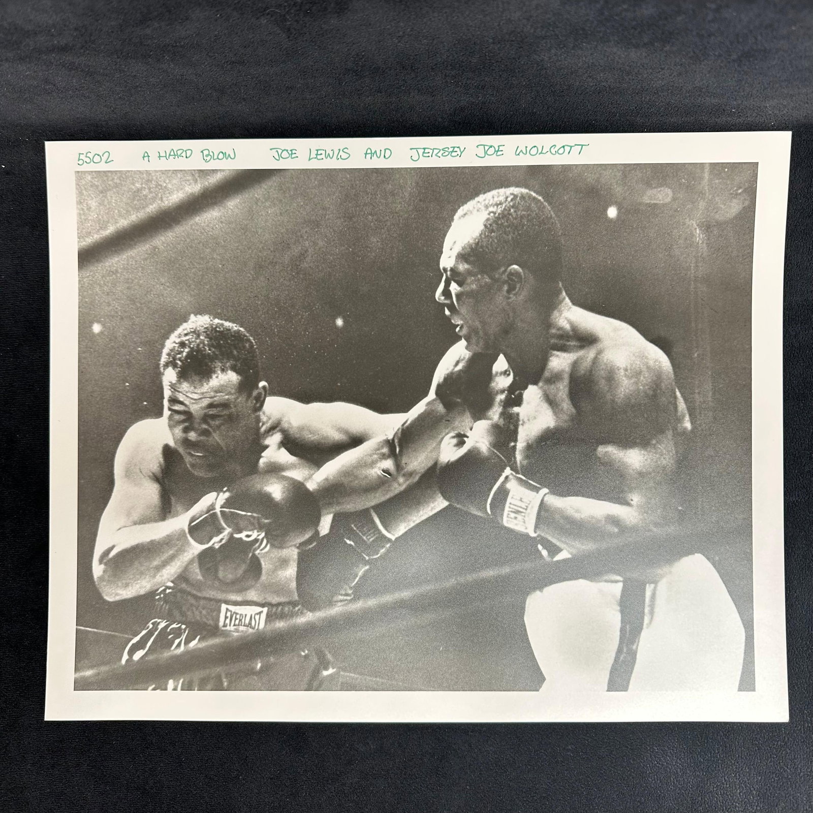 Boxing Action Analog Photograph Joe Louis and Jersey Wolcott A Hard Blow: Black and white photo print on pearl resin-coated paper titled “A Hard Blow”, depicting heavyweight champions Joe Louis "Lewis" and Jersey Joe Walcott mid-fight. The handwritten ca