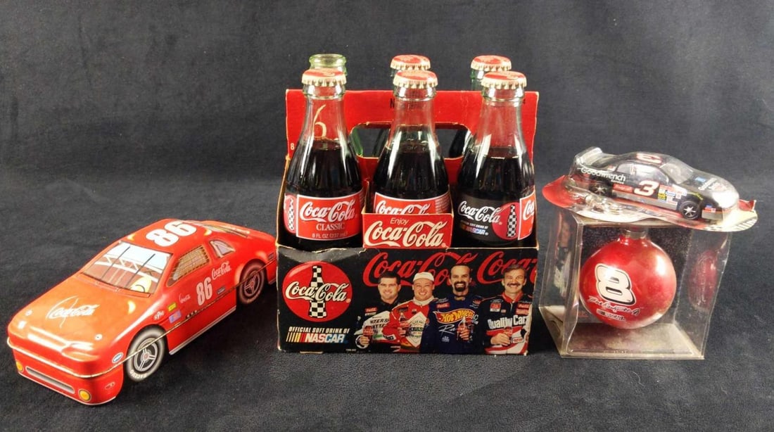 Coca Cola NASCAR Bottles Tin Keychain Ornament: This lot includes: (1) NASCAR 6 Pack Glass Bottles. 5 Bottles are NASCAR from 1996. These are filled with Coca Cola. There is one empty Bobby Labonte bottle. These are all included in a NASCAR Co