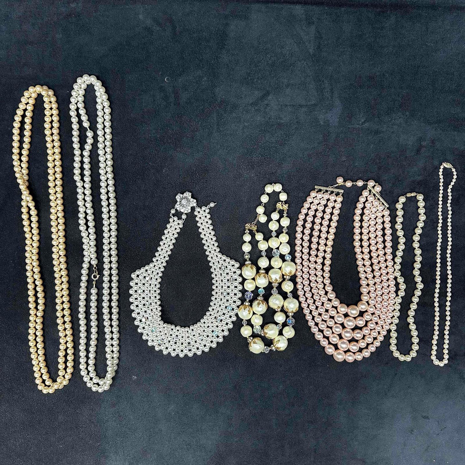 Faux Pearl Costume Jewelry Necklace Set of Seven 7 Necklaces: Various faux pearl costume jewelry necklaces, seven jewelry pieces included. Light noticeable wear throughout the necklace set. One necklace has a beautiful accent clasp. The necklaces are either sing