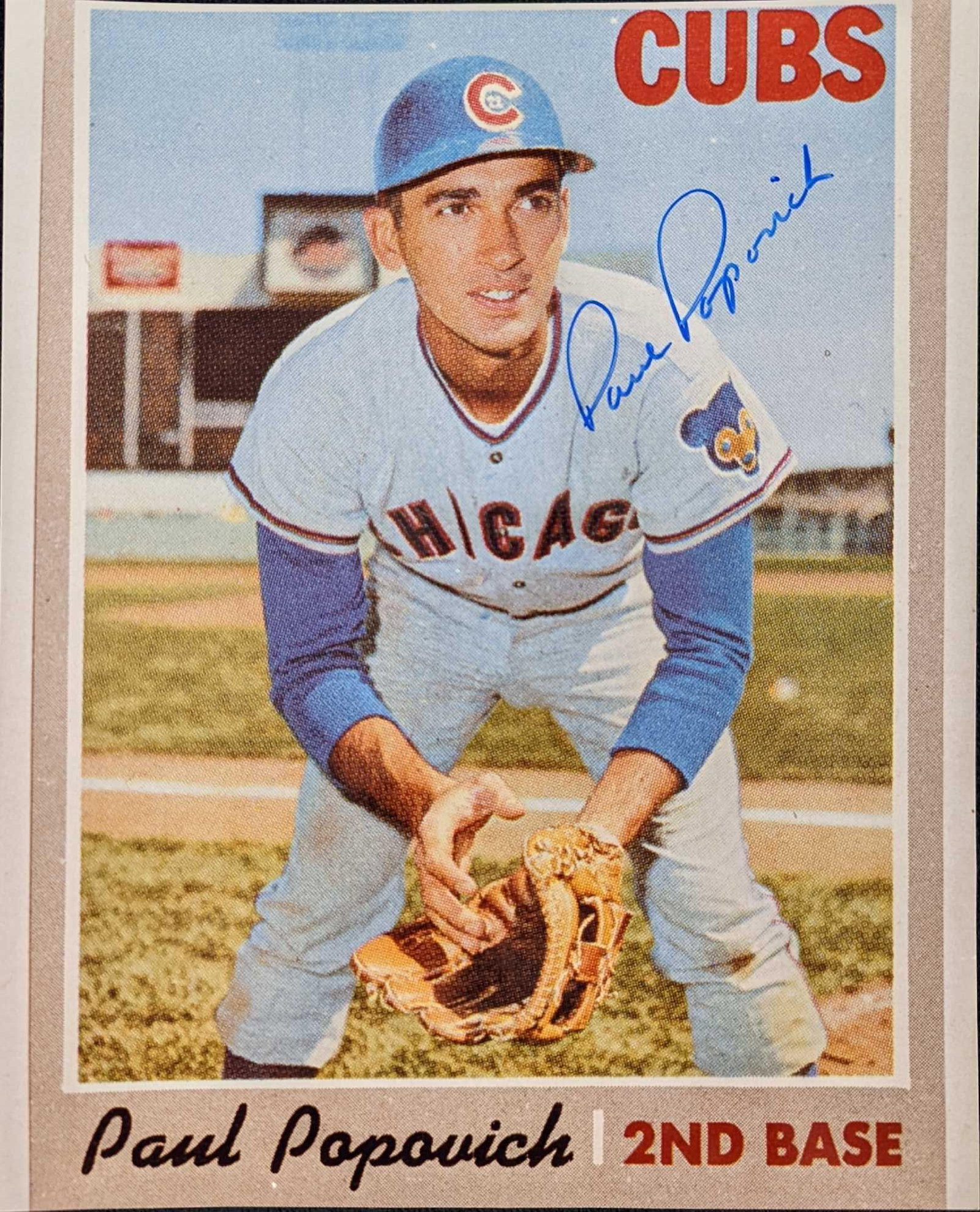 Autographed Paul Popovich 8"x10" Photo: Autographed Paul Popovich photo of a baseball card. The autograph comes with a COA from the "Sports Source". Comes in a sleeve that is approx 8 1/2" x 10" and it weighs 0.05lb. The photo has no rips o