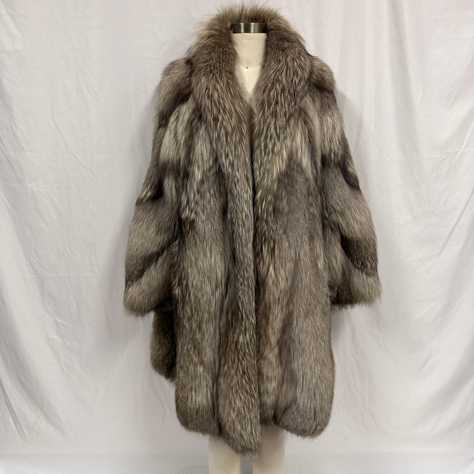 Silver Tone Gray and Black Fox Fur Coat with Shawl Type Collar FC6F: Fur coat crafted from natural fur and retains excellent volume and softness. Overall, the coat is in good pre-owned condition, with some light wear and minor separation from storage and age.
