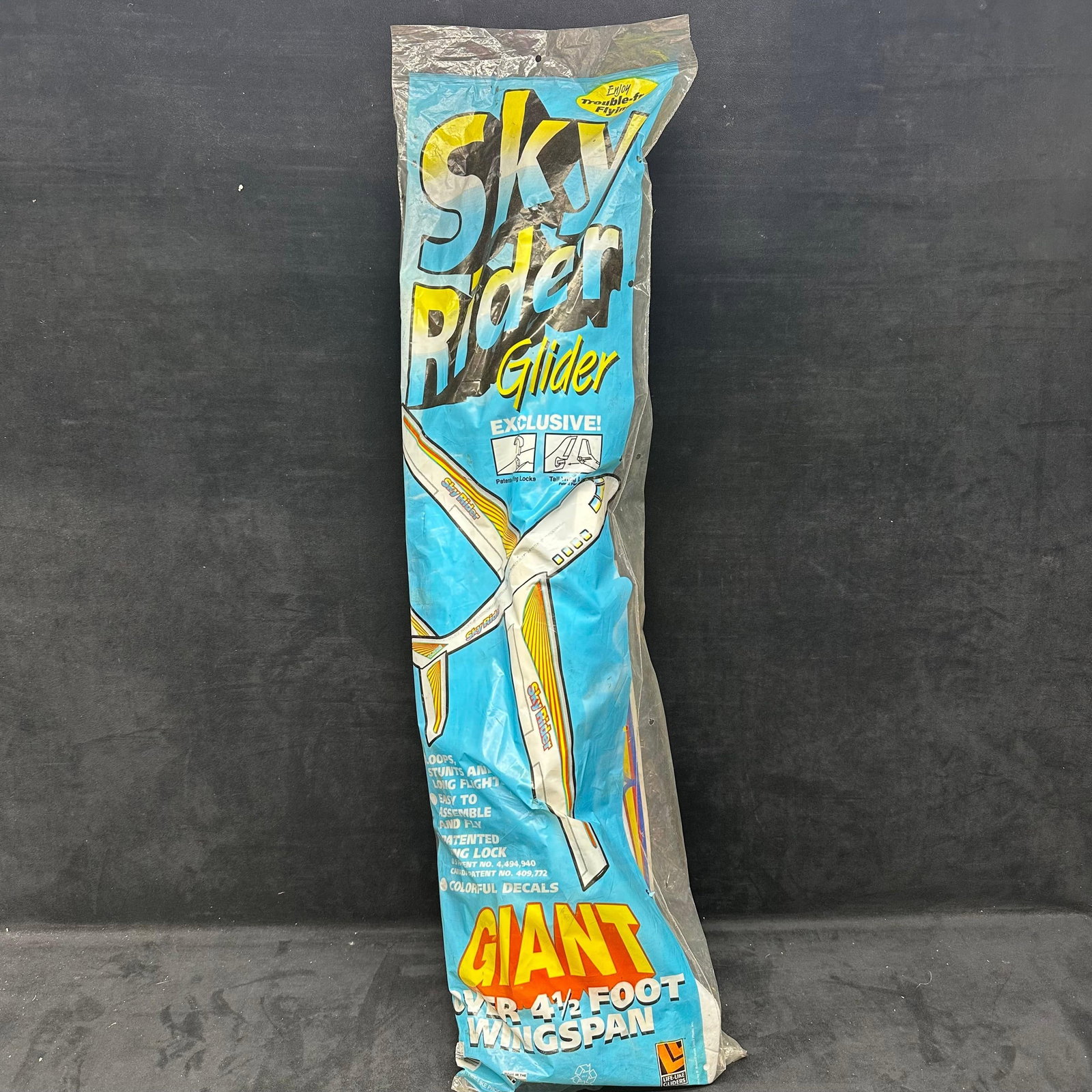 Vintage Sky Rider Glider Giant 4.5 Foot Wingspan Foam Airplane Toy In Package: Sky Rider glider foam airplane toy with original packaging, labeled giant size with approximately 4.5-foot wingspan. Includes an instruction sheet inside. Appears unused, but the packaging shows creas