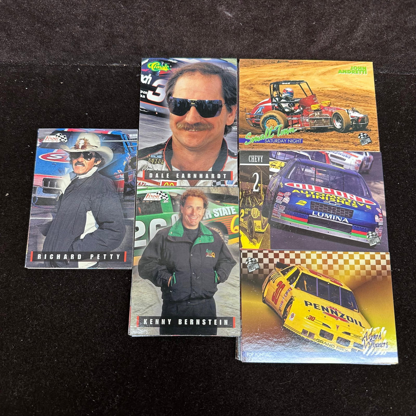 120 Pc NASCAR Racing Trading Card Lot Earnhardt Petty Gordon Wallace: A lot of approx. 120 NASCAR trading cards featuring drivers including Dale Earnhardt, Richard Petty, Jeff Gordon, Mike Wallace, and others: mixed sets, loose cards, varying condition. The lot