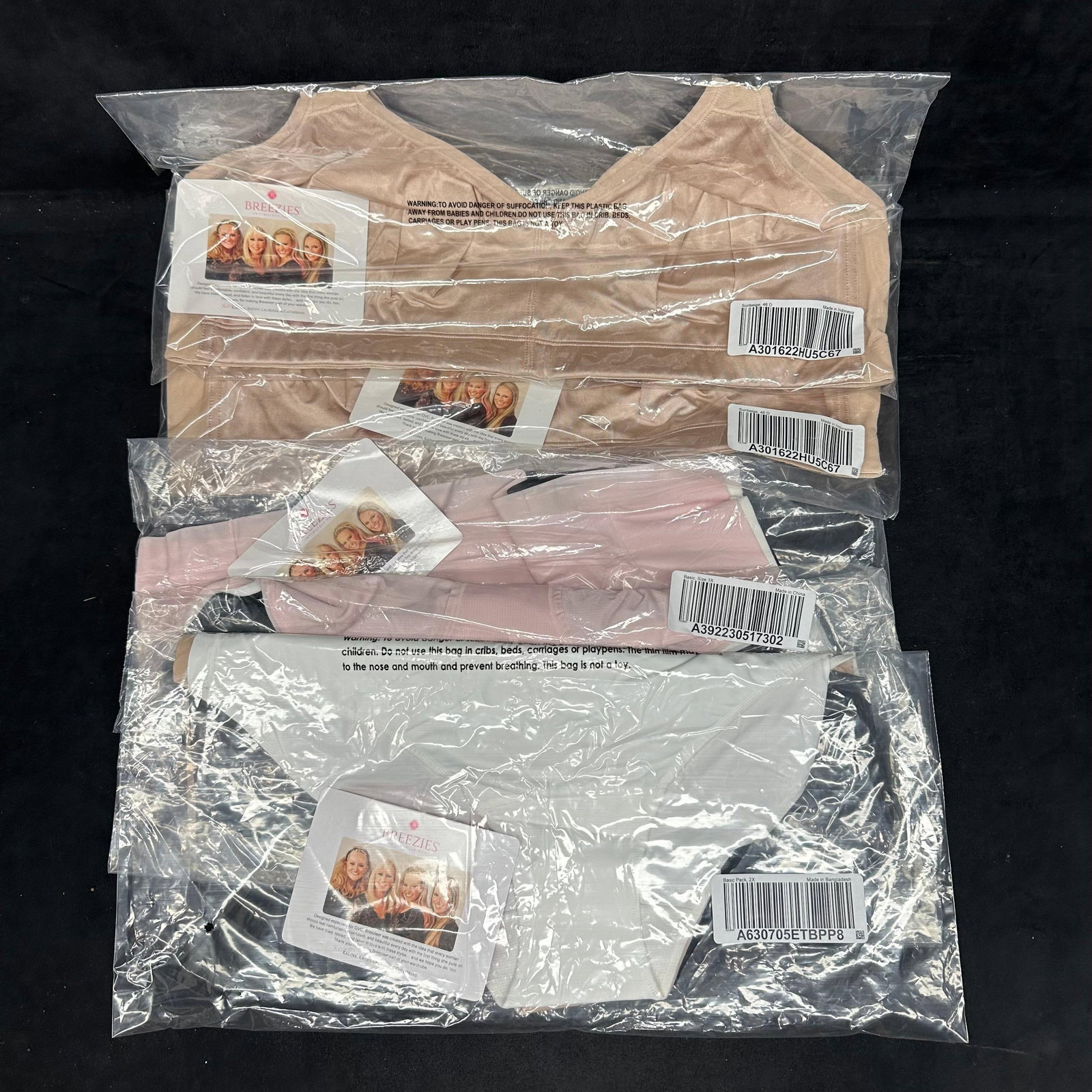 Breezies Intimates Bra Lot Assorted Sizes Colors New: Group of Breezies intimates bras, new in original packaging. Includes multiple styles and colors such as beige, black, and white, and smooth designs. Assorted sizes noted on packaging. All eight