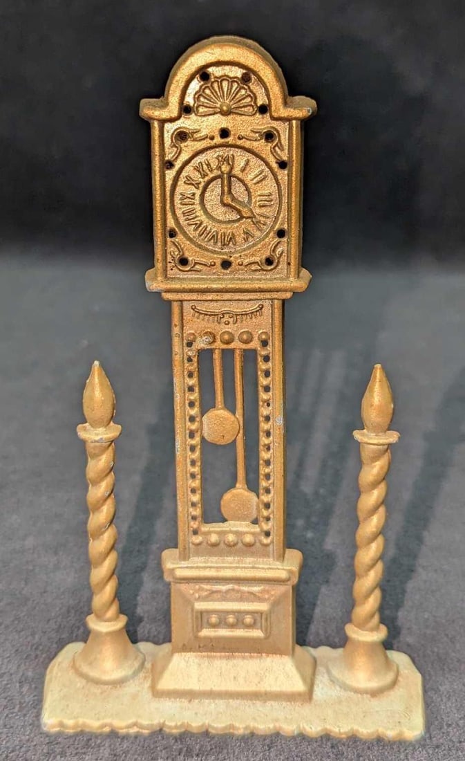 Vintage Revere Grandfather Clock Dollhouse Display: Vintage Revere Grandfather Clock Dollhouse Display. This brass-tone display (not an actual working clock) is approx 3 3/4" x 1 1/4" x 6 1/4" and it weighs 0.32lb. Has some markings and very small
