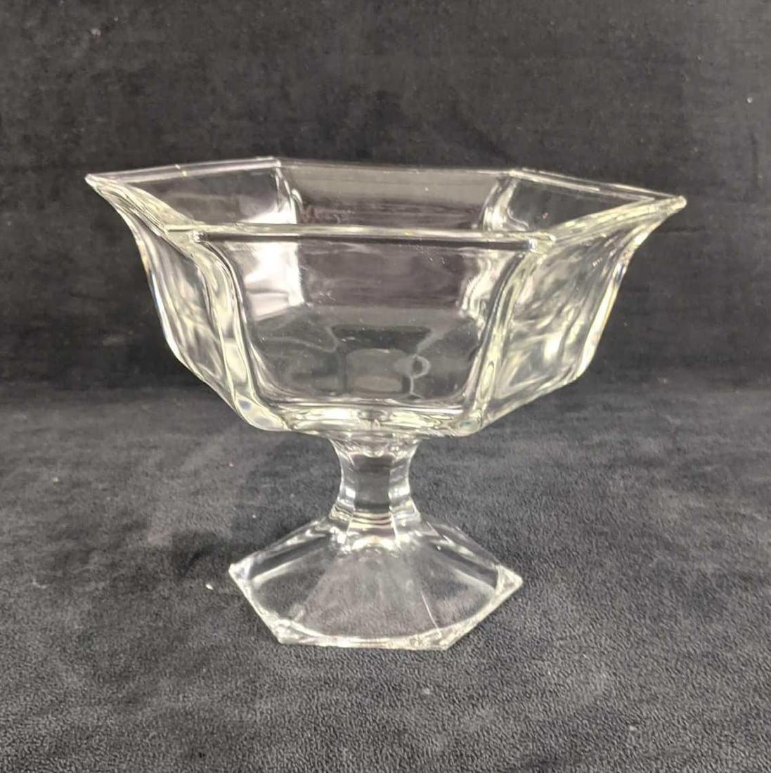 Glass Pedestal Bowl Clear: Glass Pedestal Bowl Clear This elevated bowl can be used as decor or every day in your kitchen. This diverse piece is great for any space. It has no known damage and is in good condition. 6in tall