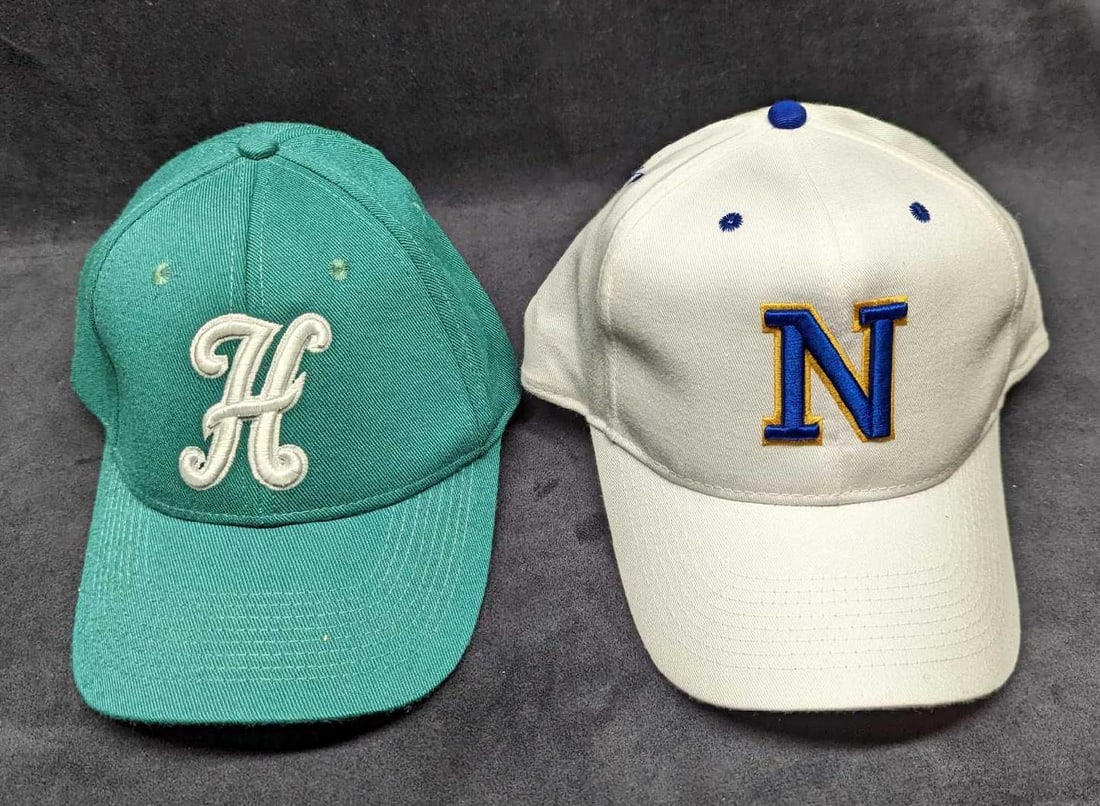 2 Rangers & Huskies Baseball Caps: 2 Rangers & Huskies Baseball Caps. This lot includes: (1) Huskies Cap By Milwaukee Sporting Goods. Size Medium. This is approx 7" x 9" x 5". (1) Rangers Cap By Calhead. Size Medium/Lar