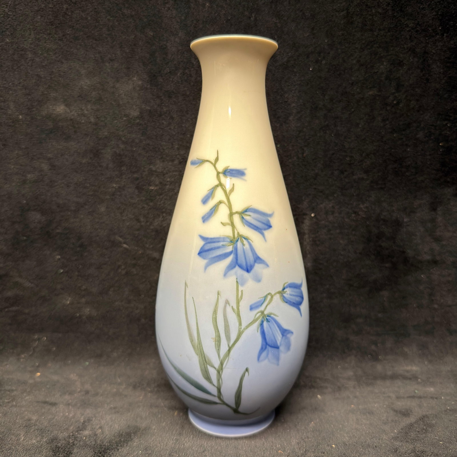 Royal Copenhagen Porcelain Vase with Blue Bell Flowers Denmark: Royal Copenhagen porcelain vase featuring a hand-decorated blue bell floral design on a white-to-blue gradient glaze. Marked Royal Copenhagen, Denmark, on the underside. This item is in pre-owned, pre