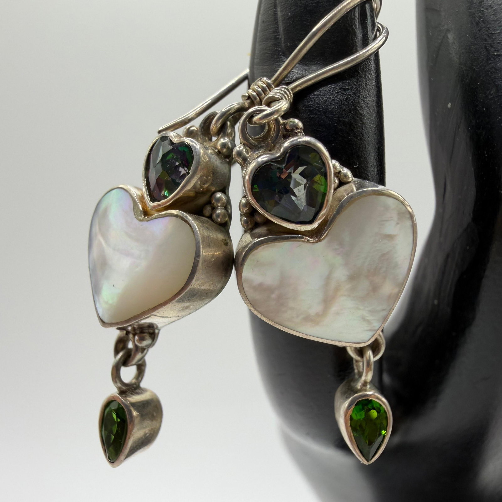 Sajen Mother of Pearl Peridot Iridescent Topaz Sterling Silver Drop Earrings: This item is in pre-owned, previously used/displayed condition with noticeable light wear and surface scratches. Please reference all photos for full details. This piece of jewelry has been tested and