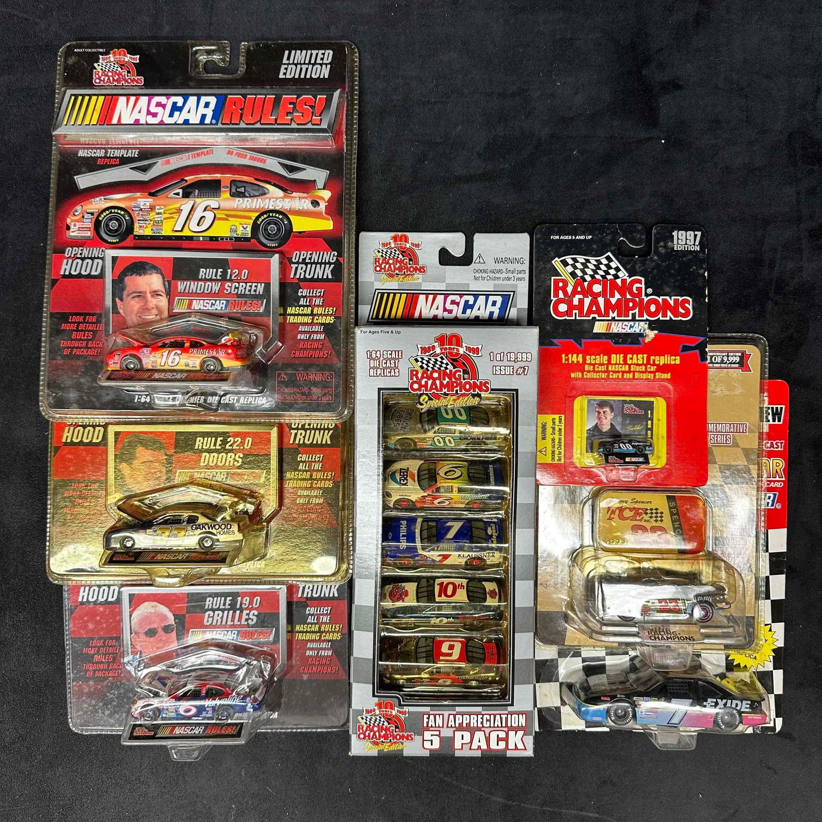 NASCAR Die-Cast Car Collection Racing Champions and Special Editions: Group of NASCAR Racing Champions die-cast collectibles, including limited edition pieces and multi-car packs. Lot features various scales including 1:64 and 1:144, with original packaging. Includes NA