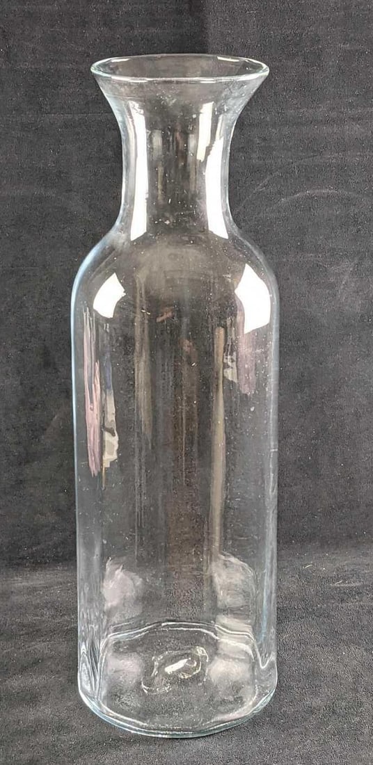 Tall Vintage Clear Glass Floor Vase: Tall Vintage Clear Glass Floor Vase. The maker and date of creation are unknown. The vase is approx 8" x 8" x 22 1/2" and it weighs 7lbs. The vase is in a good, vintage condition with some bubbles in 