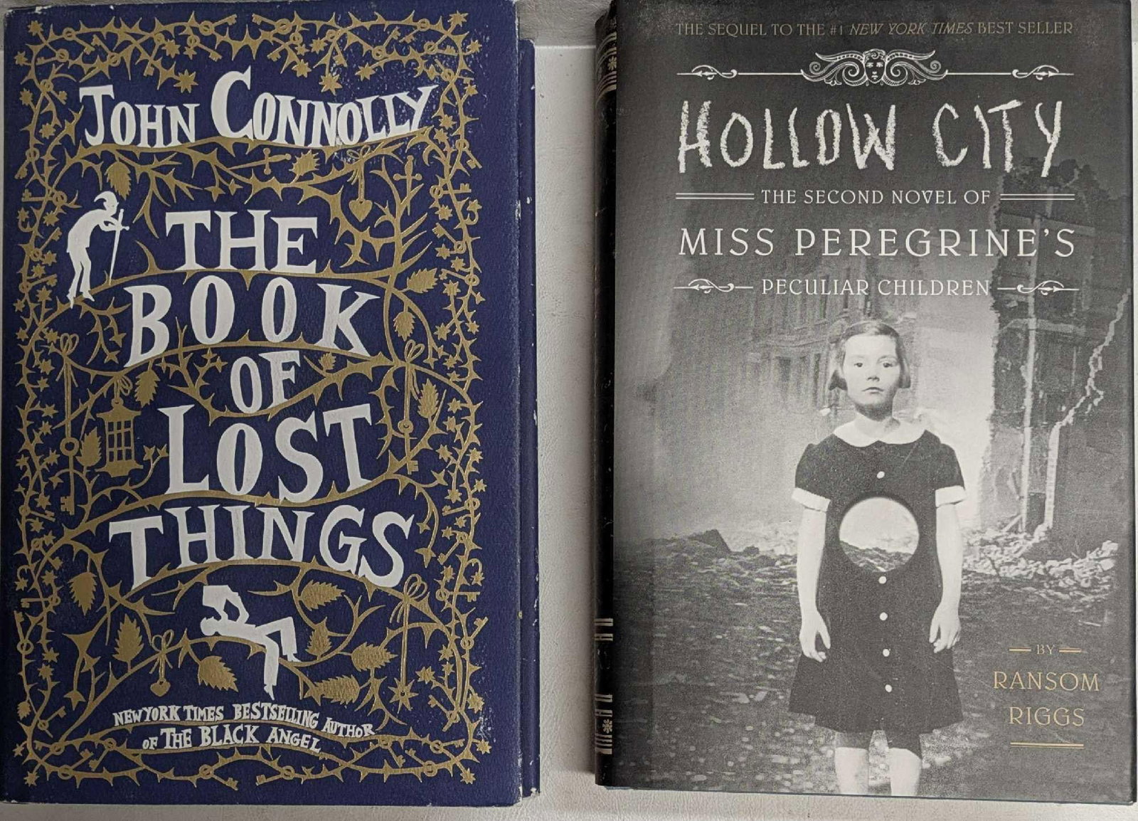 Book Of Lost Things And Hollow City Hardcover Books: Book Of Lost Things And Hollow City Hardcover Books. This lot includes: (1) The Book Of Lost Things By John Connolly. This was published by Ateia Books and was copyrighted in the year 2006. The hardco