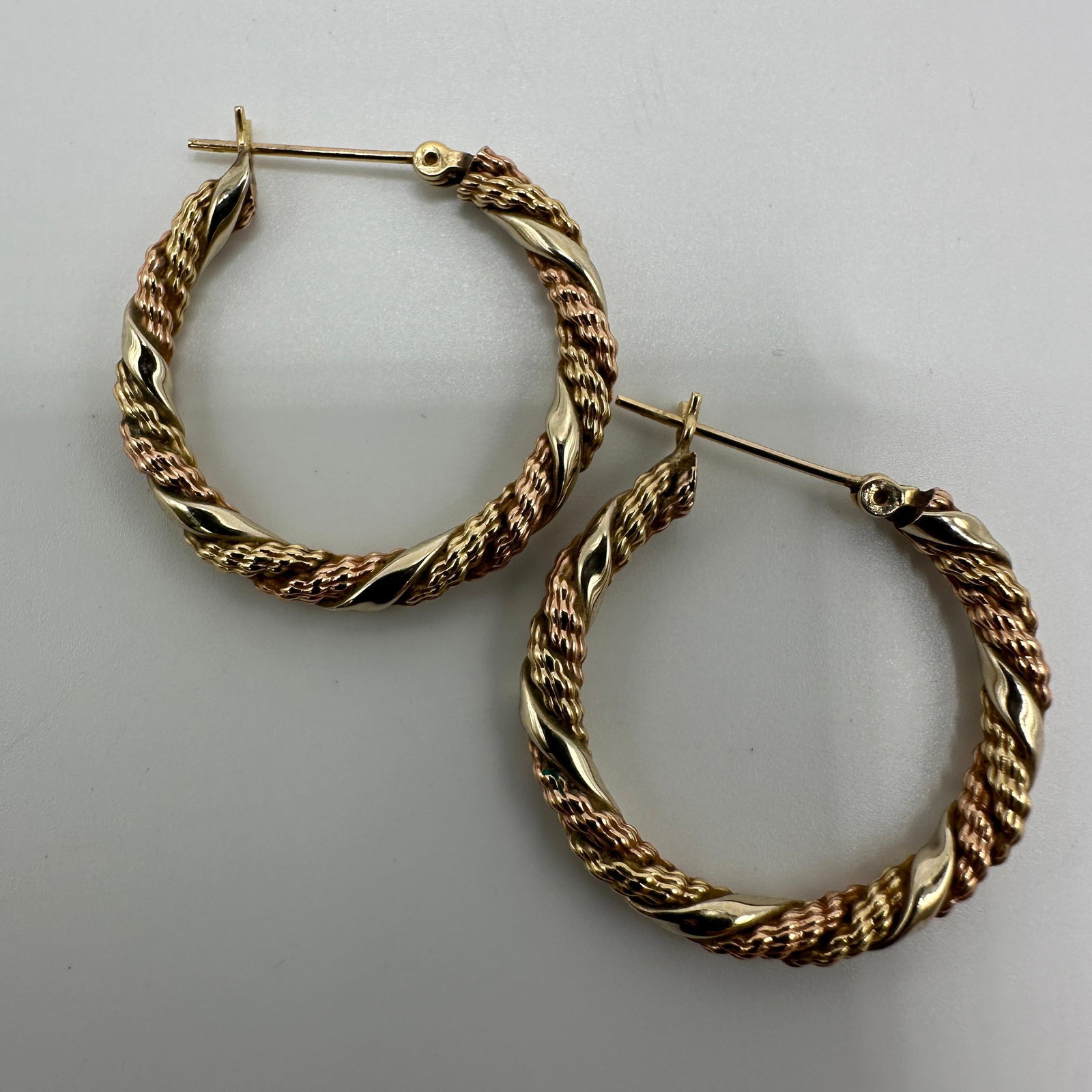14K Gold Two Tone Twist Hoop Earrings A23: This item is in good pre-owned condition, previously used/displayed, with noticeable light wear and surface scratches. Please reference all photos for full details. This piece of jewelry has been care