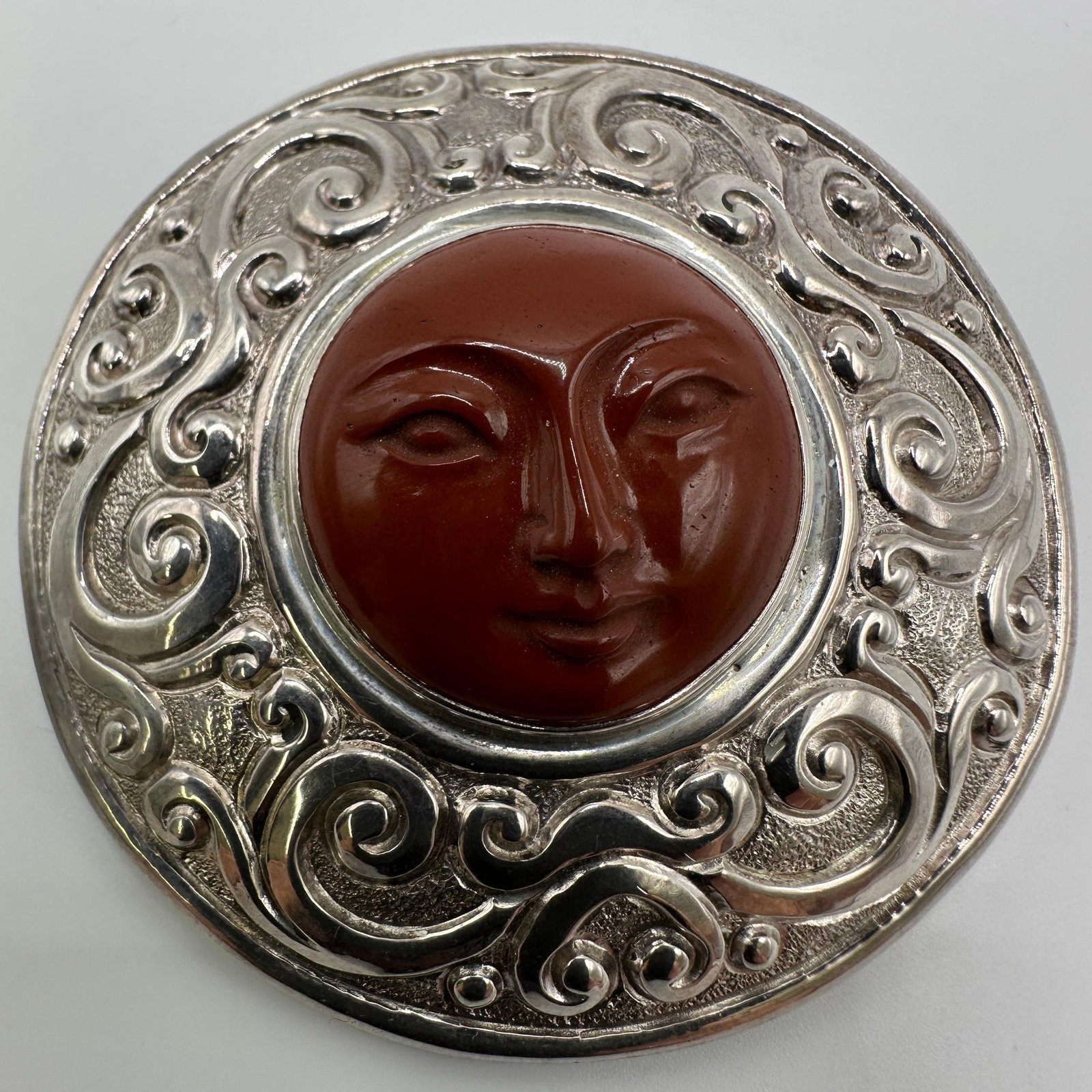 Sajen Ornate Sterling Silver Carved Face Brooch Pendant: This item is in good pre-owned, previously used/displayed condition with noticeable light wear and surface scratches. Please reference all photos for full details. This piece of jewelry has been caref