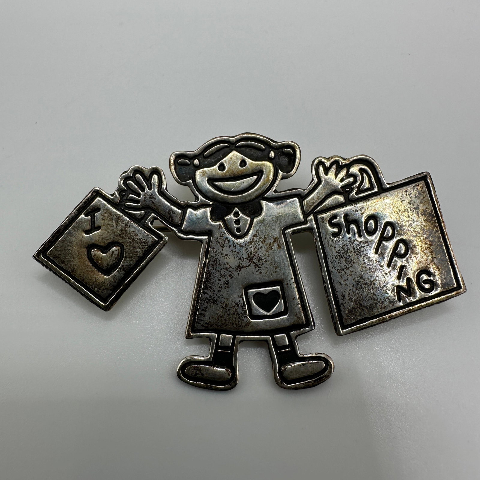 Sterling Silver Shopping Girl Figural Brooch A5: This item is in good pre-owned, previously used/displayed condition with noticeable light wear and surface scratches. Please reference all photos for full details. This piece of jewelry has been caref