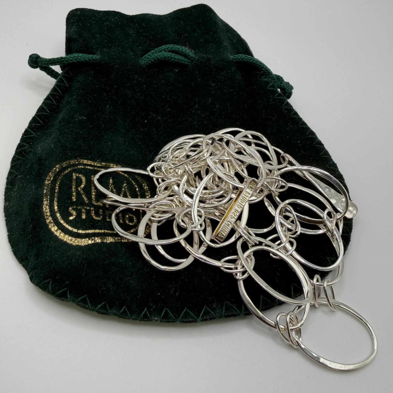 RLM Studio Hammered Modernist Interlocking Oval Sterling Silver Necklace: This item is in good pre-owned, previously used/displayed condition with noticeable light wear and surface scratches. Please reference all photos for full details. This piece of jewelry has been caref