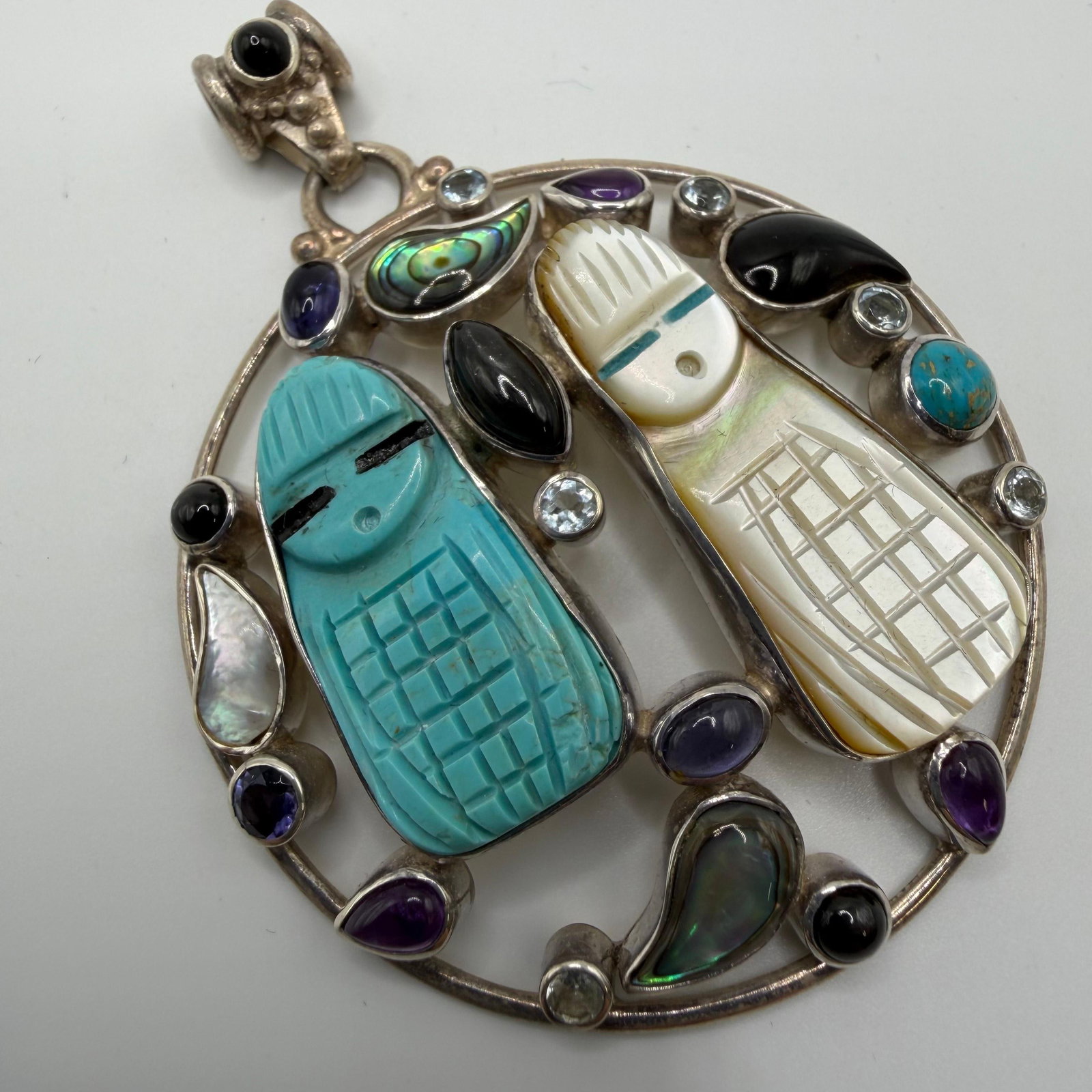 Sajen Sterling Silver Carved Figural Multi-Stone Pendant: This item is in good pre-owned, previously used/displayed condition with noticeable light wear and surface scratches. Please reference all photos for full details. This piece of jewelry has been caref