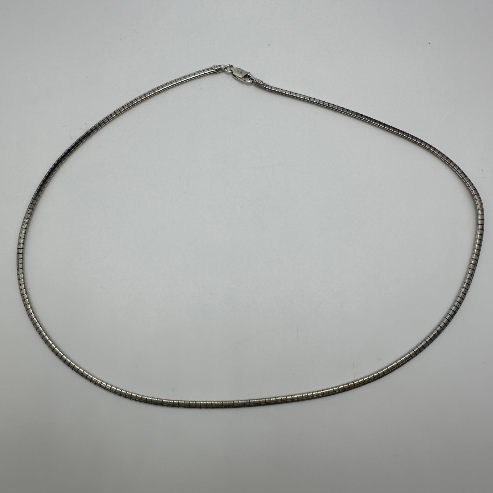 Italy 925 Flat Link Omega Snake Style Design Flexible Necklace: This item is in good pre-owned, previously used/displayed condition with noticeable light wear and surface scratches. Please reference all photos for full details. This piece of jewelry has been caref