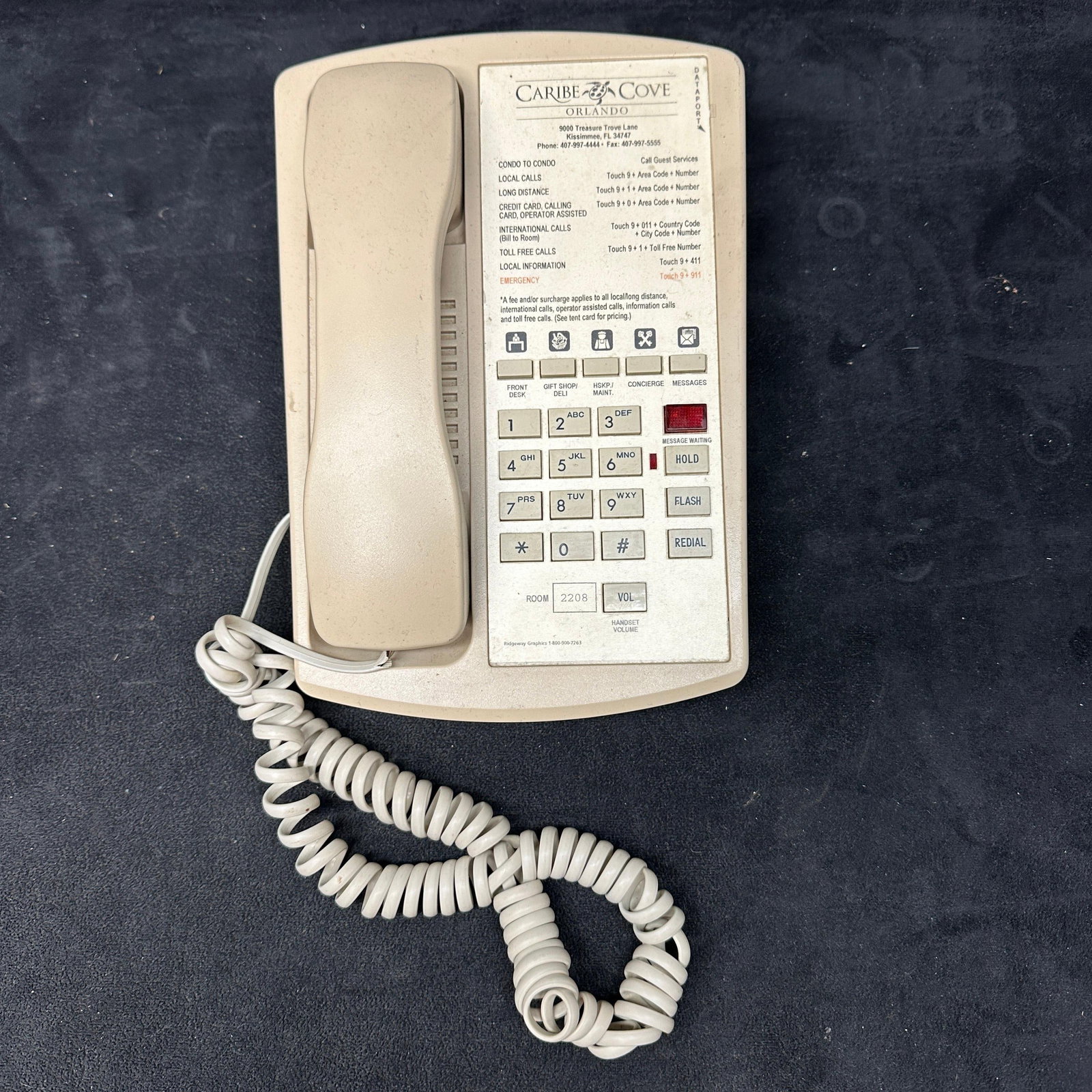 Caribe Cove Orlando Hotel Room Push Button Telephone: Vintage beige/cream push-button hotel room telephone from Caribe Cove Orlando in Kissimmee, Florida. Features printed guest service directory, hold, flash, redial, and volume controls. Back marked Sci
