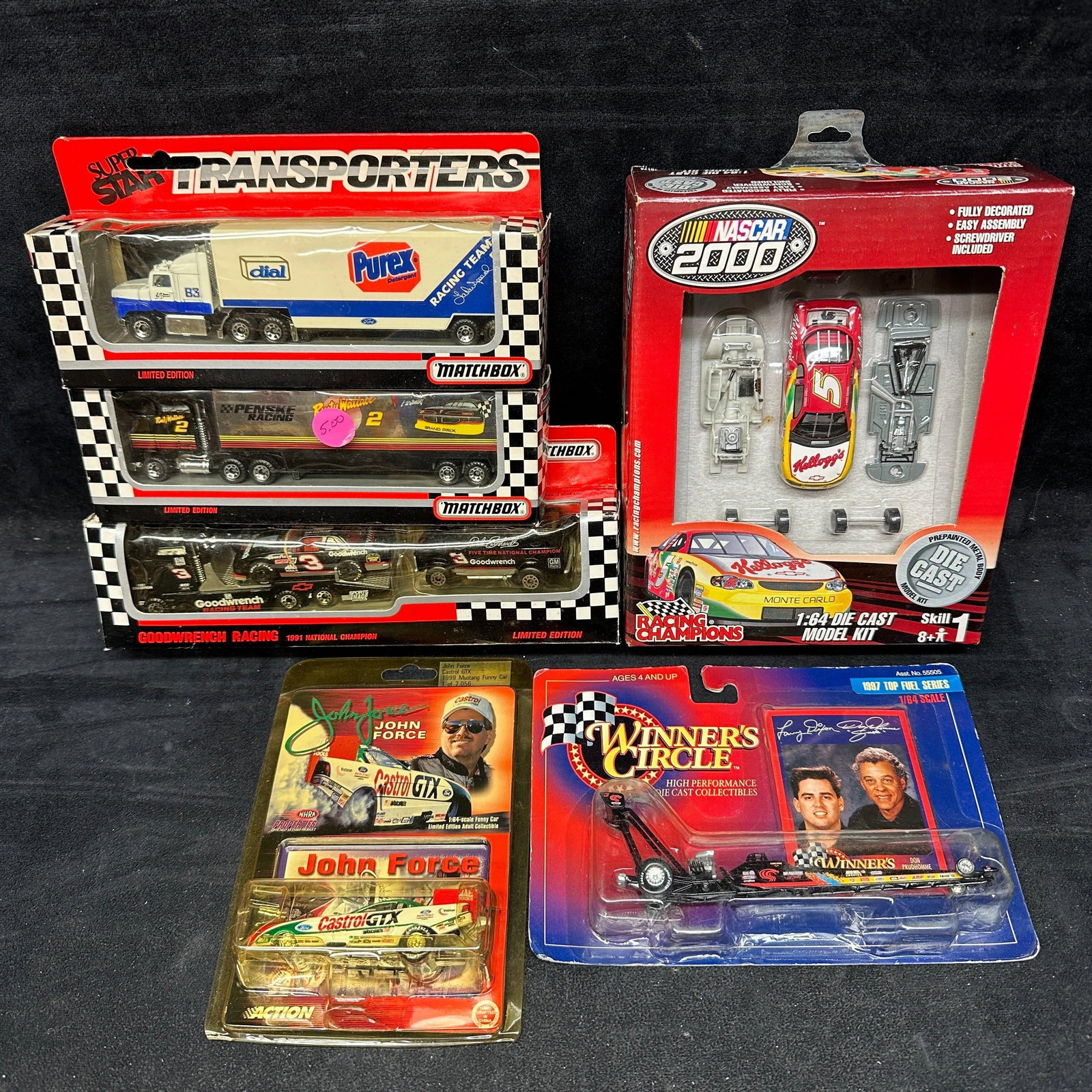 NASCAR Die Cast Racing Collectibles Group Including Dale Earnhardt And John Force: Group of NASCAR and drag racing die cast collectibles, including Matchbox Super Star Transporters, Dale Earnhardt Goodwrench Racing transporter, Rusty Wallace Penske Racing transporter, Purex Racing T