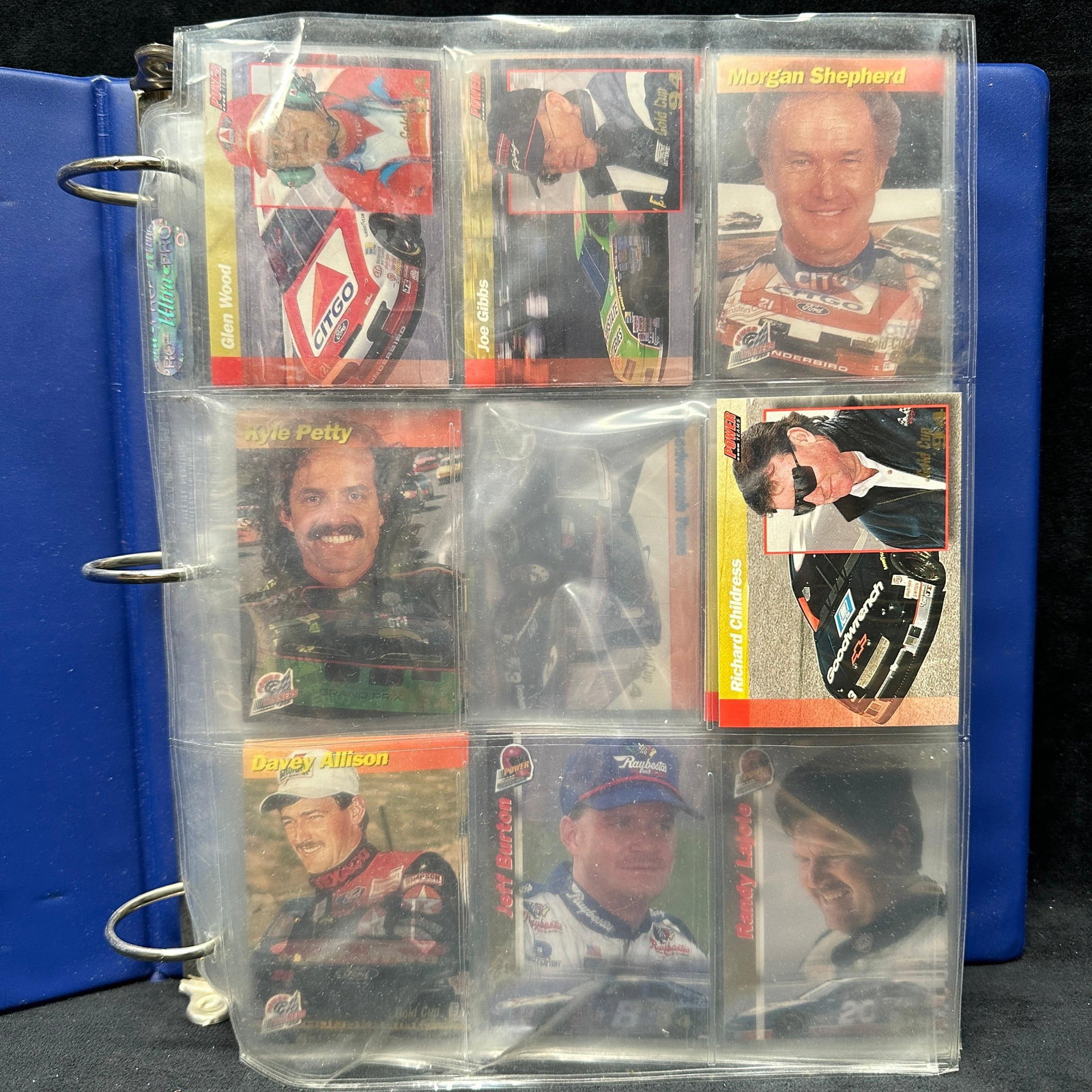 NASCAR Racing Trading Card Collection Binder Rusty Wallace Earnhardt Petty: Vintage NASCAR trading card collection housed in a blue collector’s binder with plastic sleeve pages. Includes assorted driver, owner, crew chief, and racing-themed cards featuring Richard Petty
