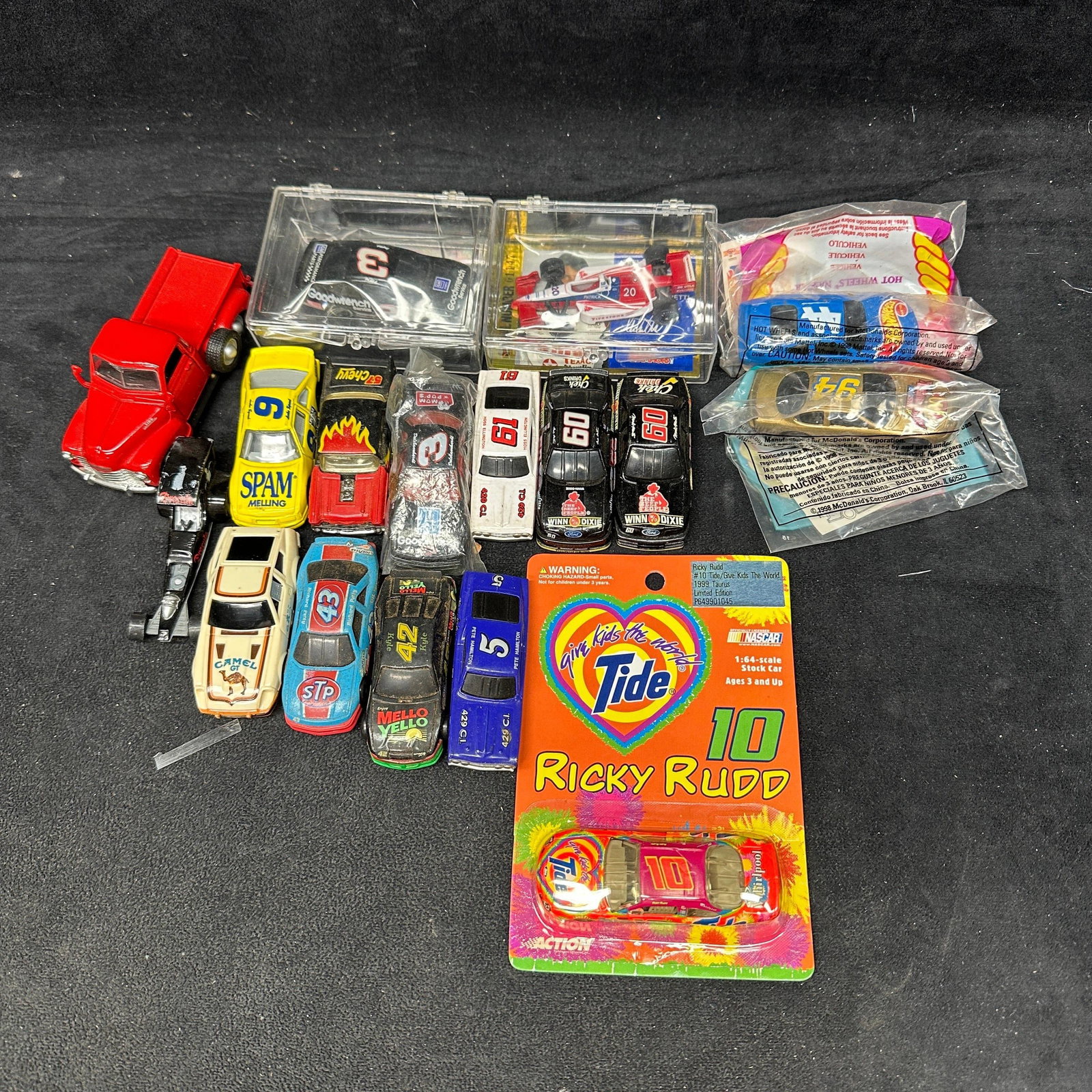 NASCAR Die Cast And Toy Vehicle Collection Lot Camel: Mixed lot of vintage die-cast toy vehicles, including NASCAR stock cars, promotional cars, Ricky Rudd Tide limited edition carded vehicle, McDonald’s promotional Happy Meal toy cars in sealed ba