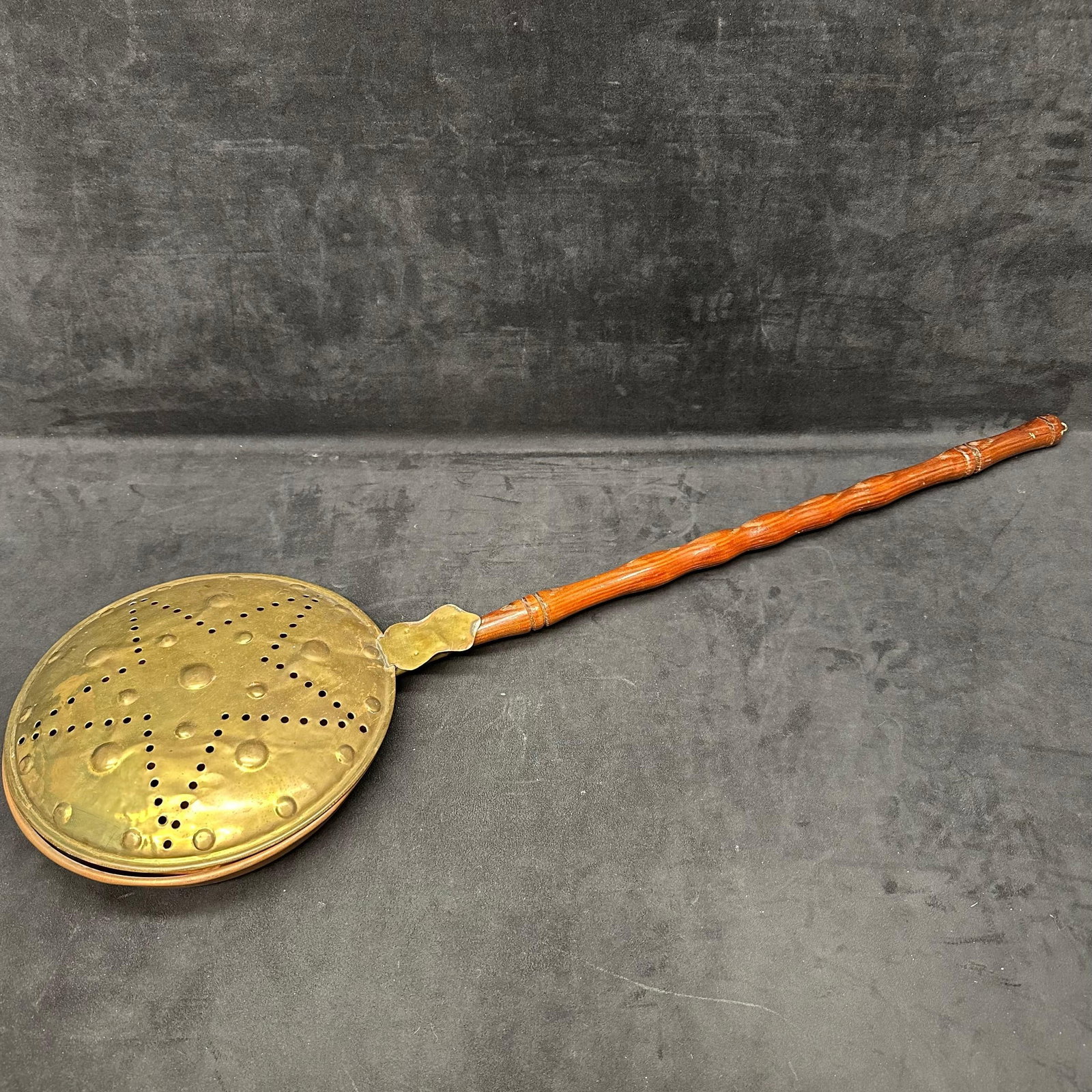 Brass and Copper Bed Warmer with Turned Wood Handle Star Pattern Lid: Classic vintage brass and copper bed warmer featuring a hinged lid with punched star and dotted design, and a long turned wooden handle. The interior shows copper lining typical of mid-20th-century