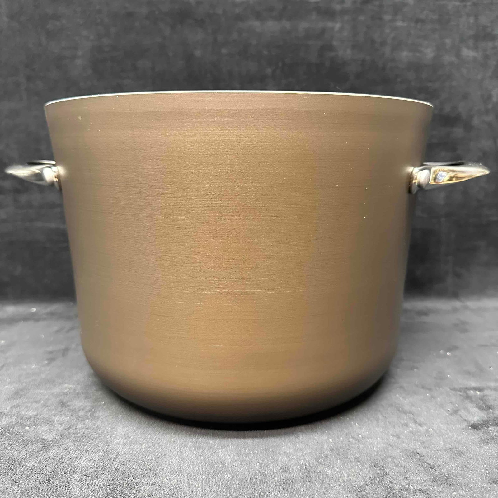 Calphalon 8 Quart Hard Anodized Stock Pot with Dual Handles: Calphalon 808 8-quart stock pot with dual handles, marked “Dishwasher Safe” and “Made in Toledo, Ohio USA.” Heavy-duty anodized construction designed for durability and even