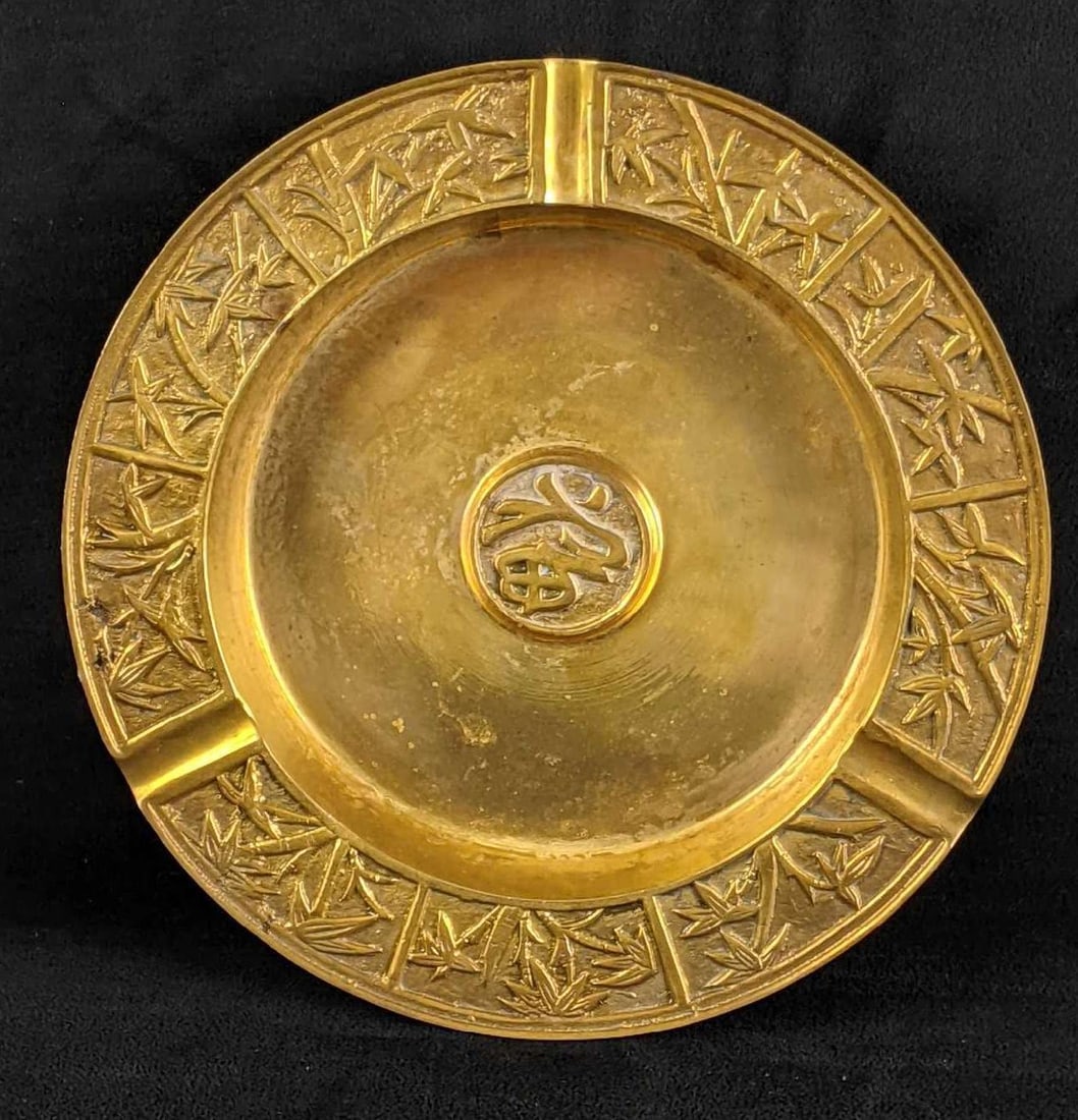 Solid Brass Ash Tray with Patina: Solid Brass Ash Tray with Patina This beautiful ashtray has three notches for cigarettes to rest on. It has a great weight to it. This is a great piece to have in your collection. There is some adhesi