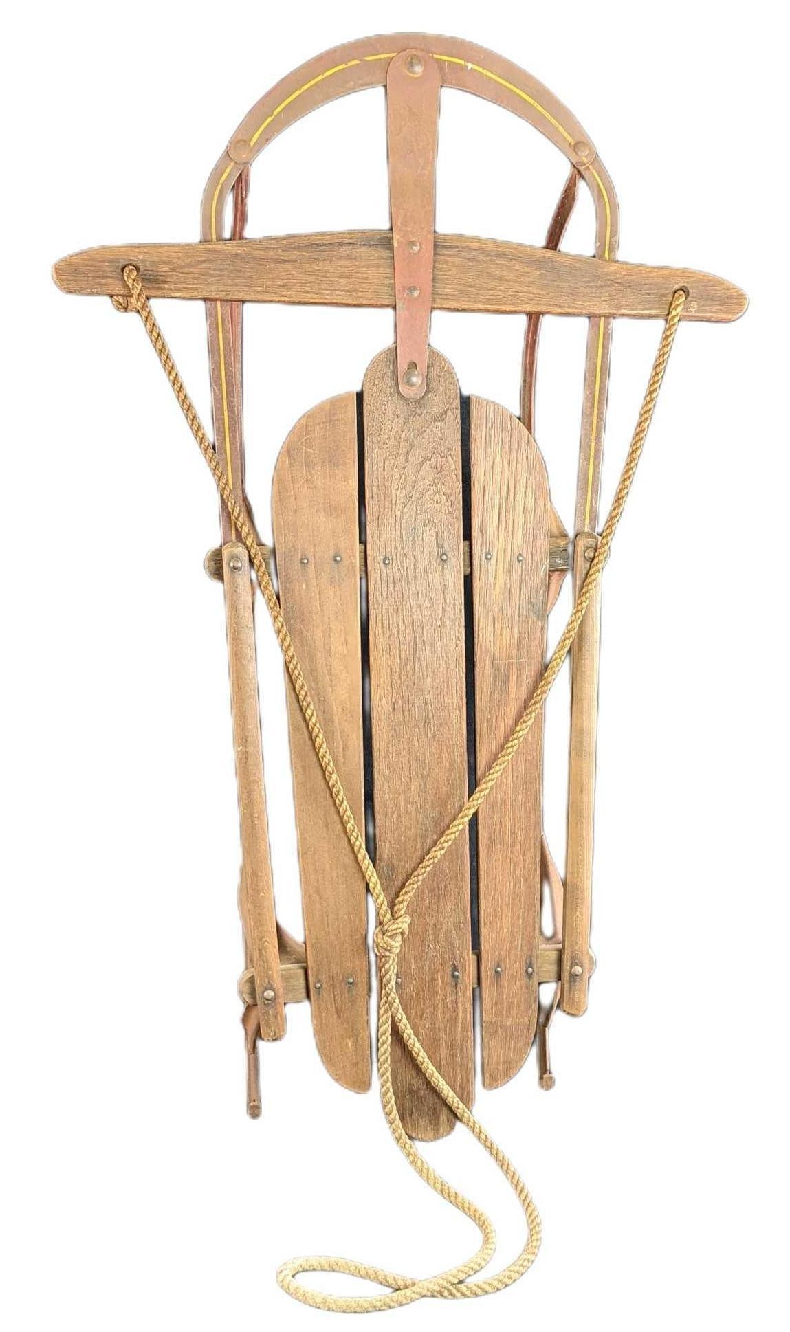 Wooden & Metal Vintage King Of The Hill Sled: Steel runners, Wooden handle and top deck. Is approx 36" x 22 1/2" x 8" and it weighs 7lbs. The sleigh is in a good, vintage condition with some light surface rust and the red color has faded along