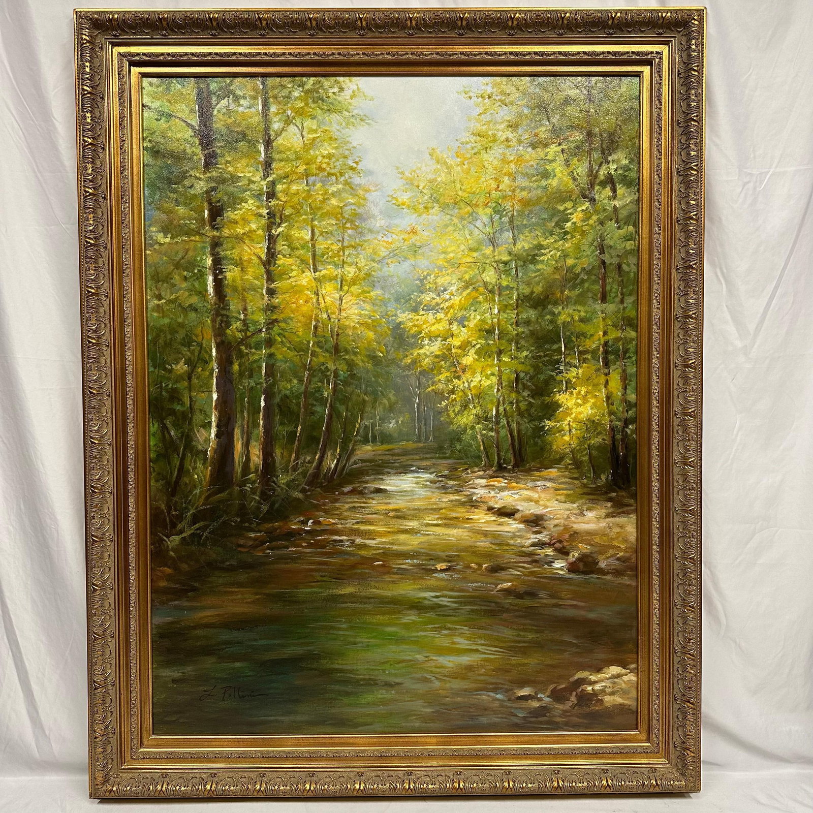 L. Pollini Signed Forest Stream Landscape Oil Painting on Canvas Framed Gold Ornate Large Frame R214: Hand-painted oil on canvas depicting a serene forest landscape with a flowing stream and autumn foliage. Signed lower left “L. Pollini. Painting features strong use of light and color with visib