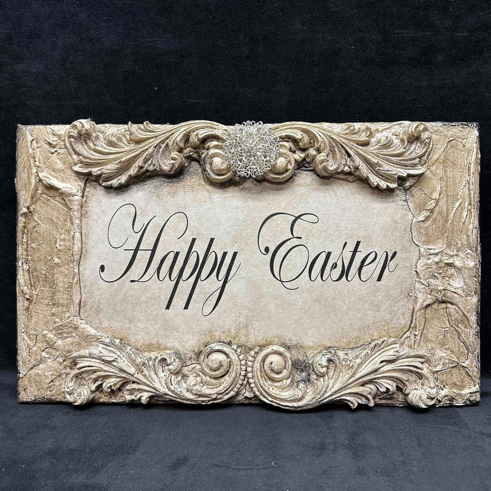 Michelle Butler Designs Happy Easter Plaque: Minor chips on resin wood decor. Plaque hand crafted art piece featuring rhinestone accents. Signed by artist Michelle Butler on the back. This item is in good pre-owned, previously displayed conditio