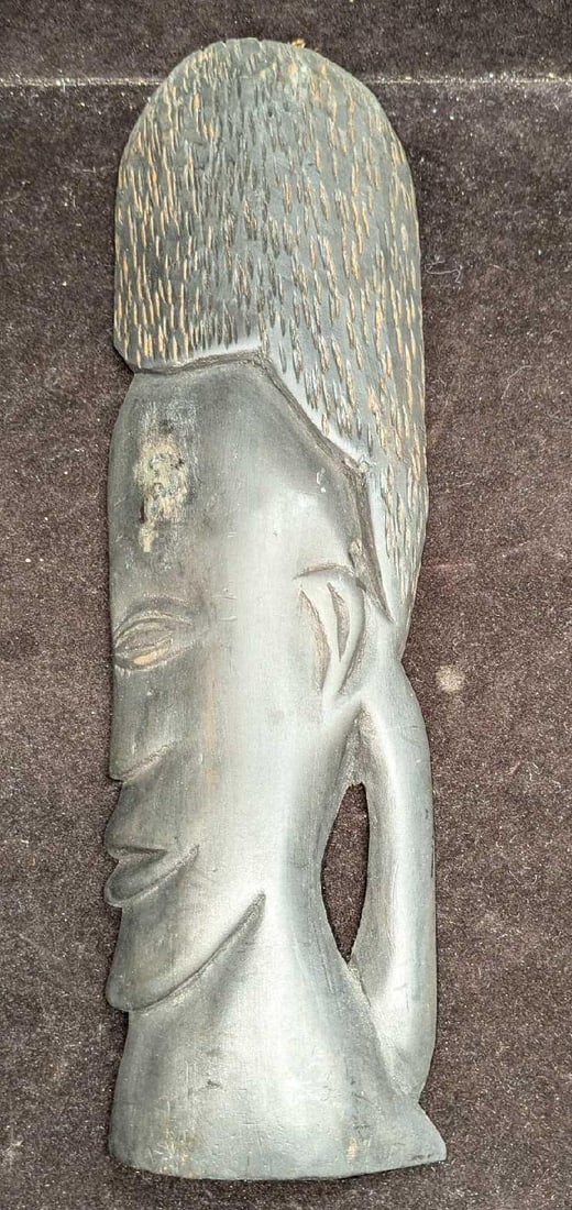 Vintage Carved Ironwood Tribal Man Wall Art: Vintage Carved Ironwood Tribal Man Wall Art. This is approx 4" x 1 1/2" x 12 1/2" and it weighs 0.49lb. There are some markings on the forehead and chips. Please see the images as they are part of the