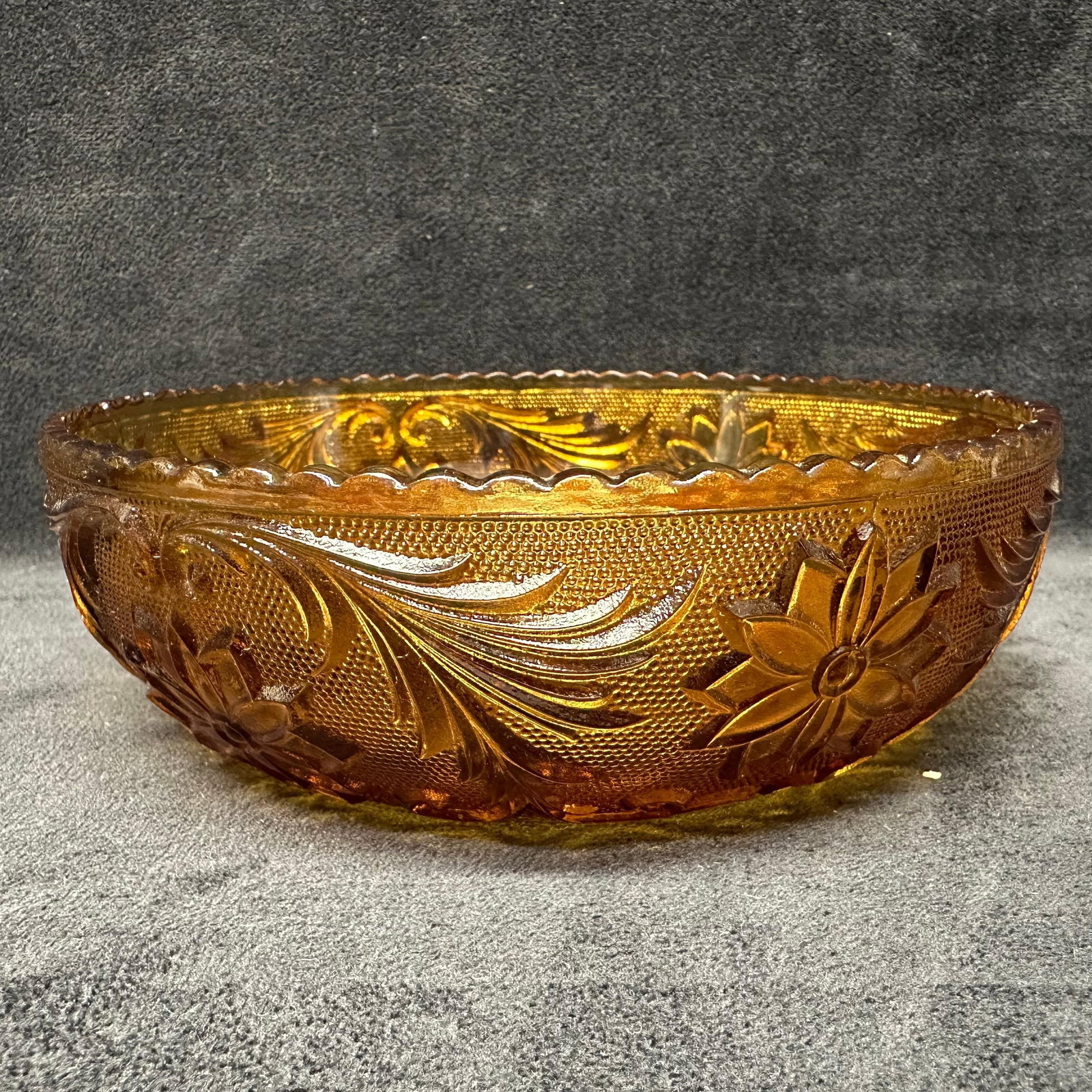 Amber Brown Pressed Glass Floral Pattern Serving Bowl Dish: Beautiful vintage amber pressed glass bowl featuring an intricate raised floral and scroll design with a scalloped rim. The rich brown honey-amber hue and textured detailing. Minor scratch on the inte
