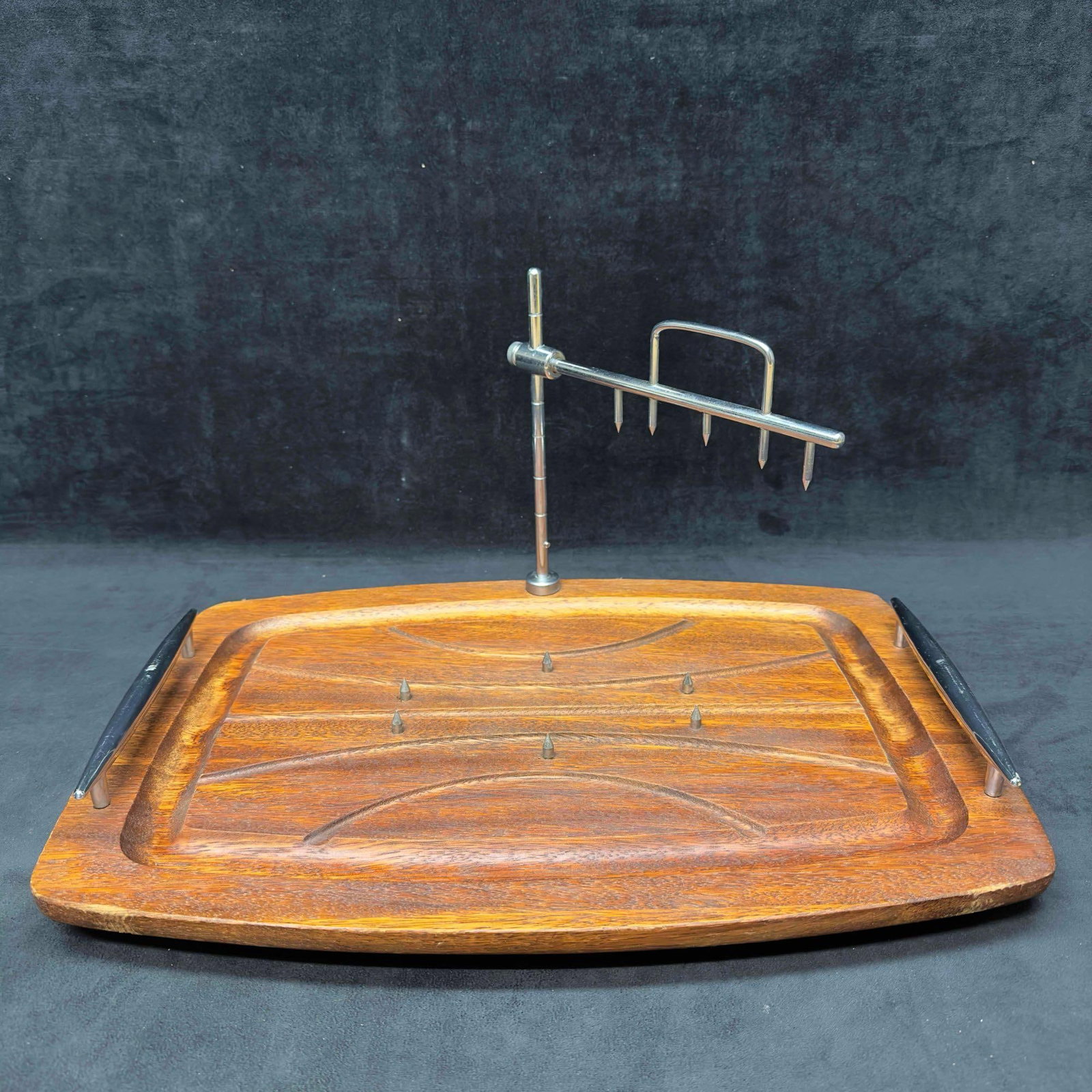 Vintage Wood Meat Carving Board Tray with Spikes and Spiked Holder Attachment: Vintage Wood Meat Carving Board Tray with Spikes and Spiked Holder Attachment. This vintage cutting board is crafted from high-quality wood, it features a dark brown color with stainless steel ha