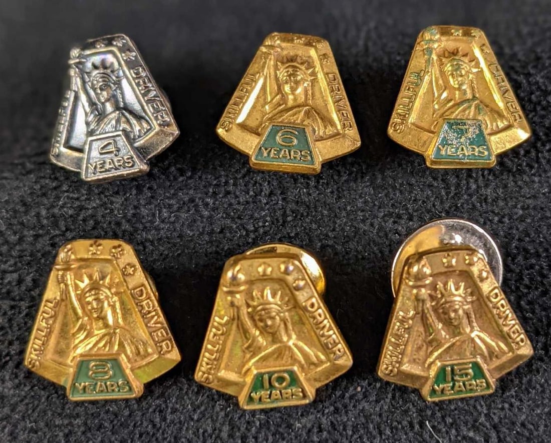 Six Vintage UPS Skilful Driver Tie Tacks: This lot includes special tie-tacks given to UPS drivers who have driven a UPS vehicle without an avoidable accident. This lot includes years: 4, 6, 7, 8, 10 and 15 years. Each pin is approx 1" x 1"