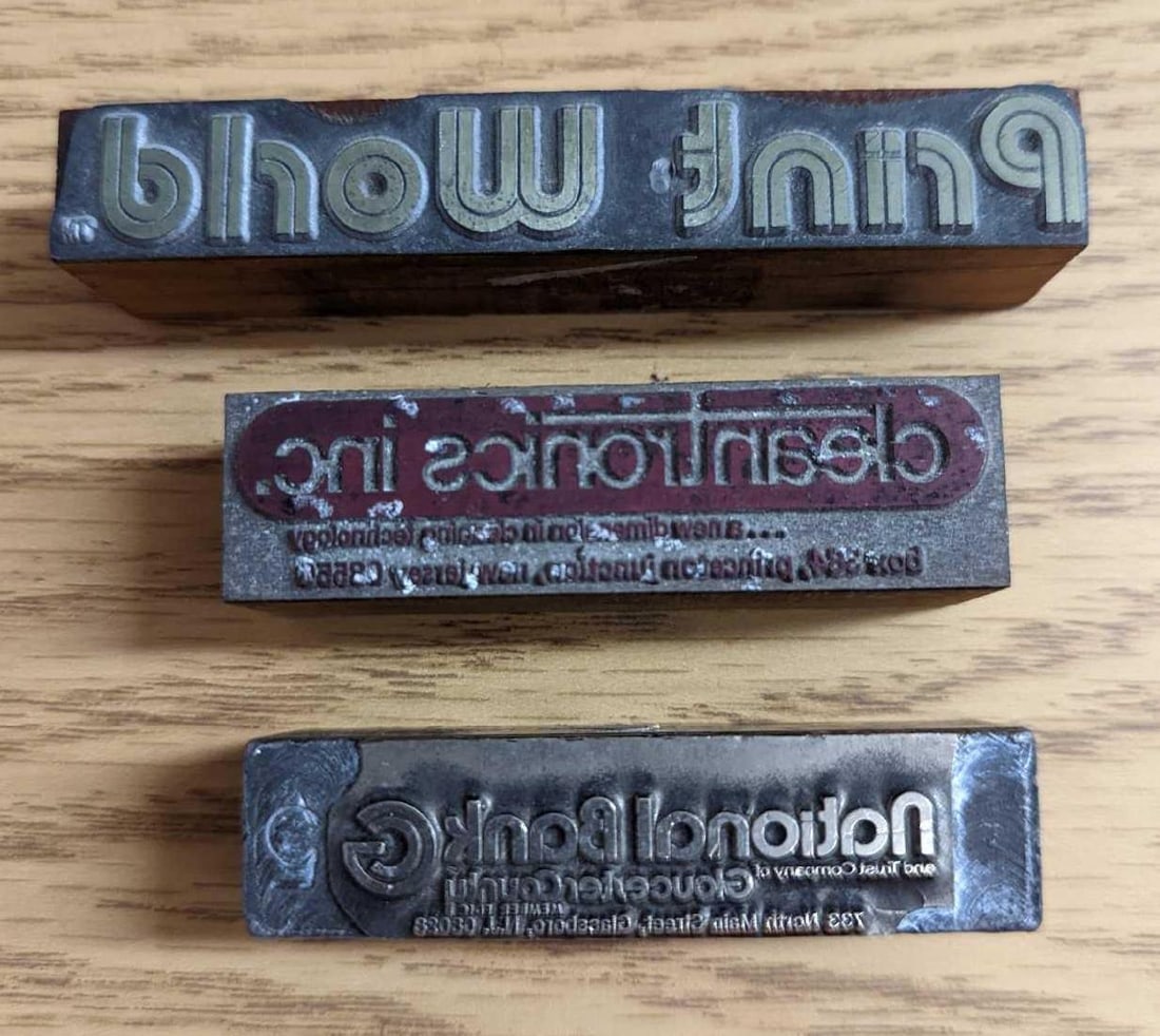 3 Vintage Company Names Printing Blocks Stamps: 3 Vintage Company Names Printing Blocks Stamps. This lot includes: (1) Print World. This is approx 3 1/2" x 1" x 1/2". (1) National Bank. This is approx 2 1/2" x 3/4" x 3/4&#