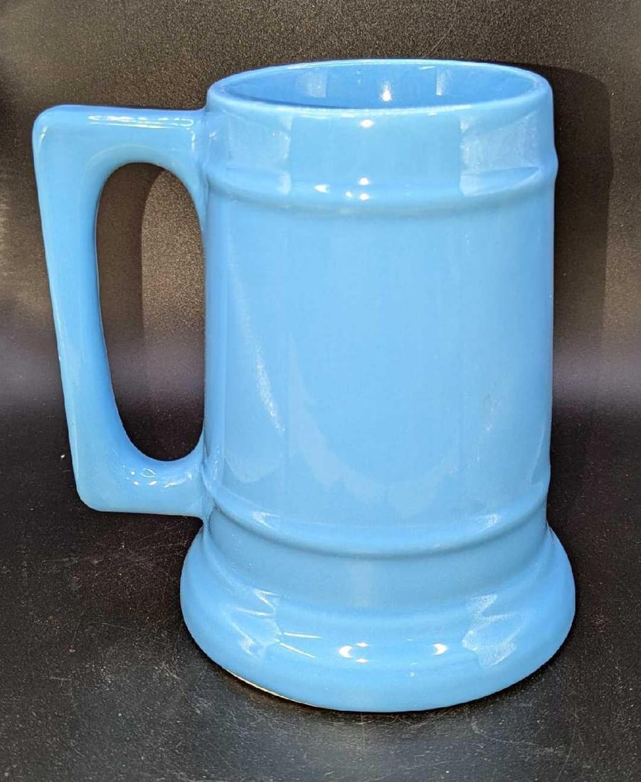 Vintage Starcrest Blue Pottery Stein: Vintage Starcrest Blue Pottery Stein. Made in the USA. This is approx 5 1/4" x 4 3/4" x 6" and it weighs 2.01lbs. There is a small chip/imperfection on the handle. Please see the images as they are pa