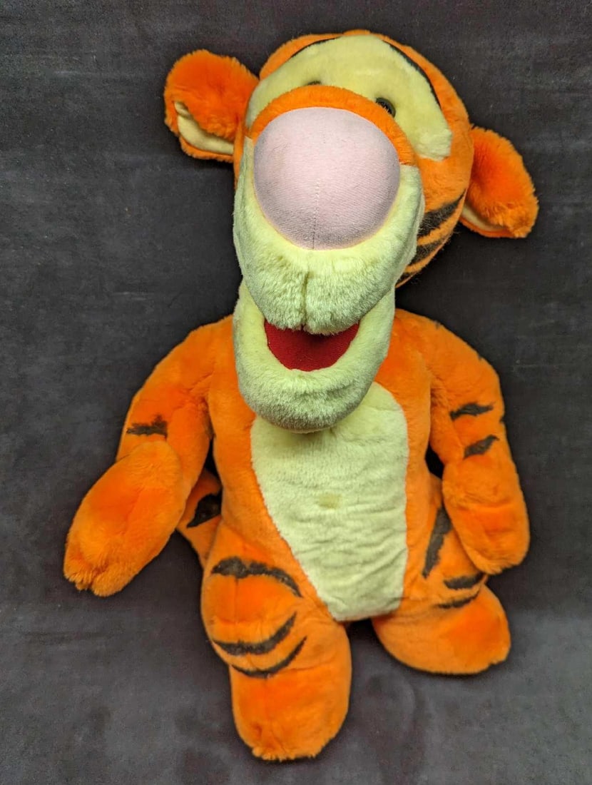90's Winnie the Pooh Tigger Jumbo Plush: 90's Winnie the Pooh Tigger Jumbo Plush. Is approx 14" x 10" x 23" and it weighs 2.40 lbs. Can stand on its own, but the head turns to roll to the right. There is also some discoloration on the chest.