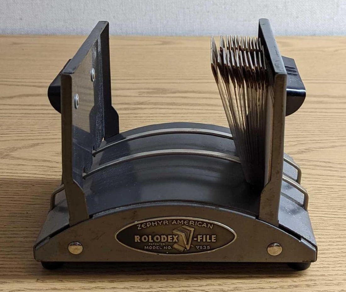 Vintage Zephyr American Rolodex File: Vintage Zephyr American Rolodex File. Model V535. This is approx 7" x 5 3/8" x 5" and it weighs 2.28lbs. The Rolodex has some markings and scratches. It comes with letter separators (and is missing th
