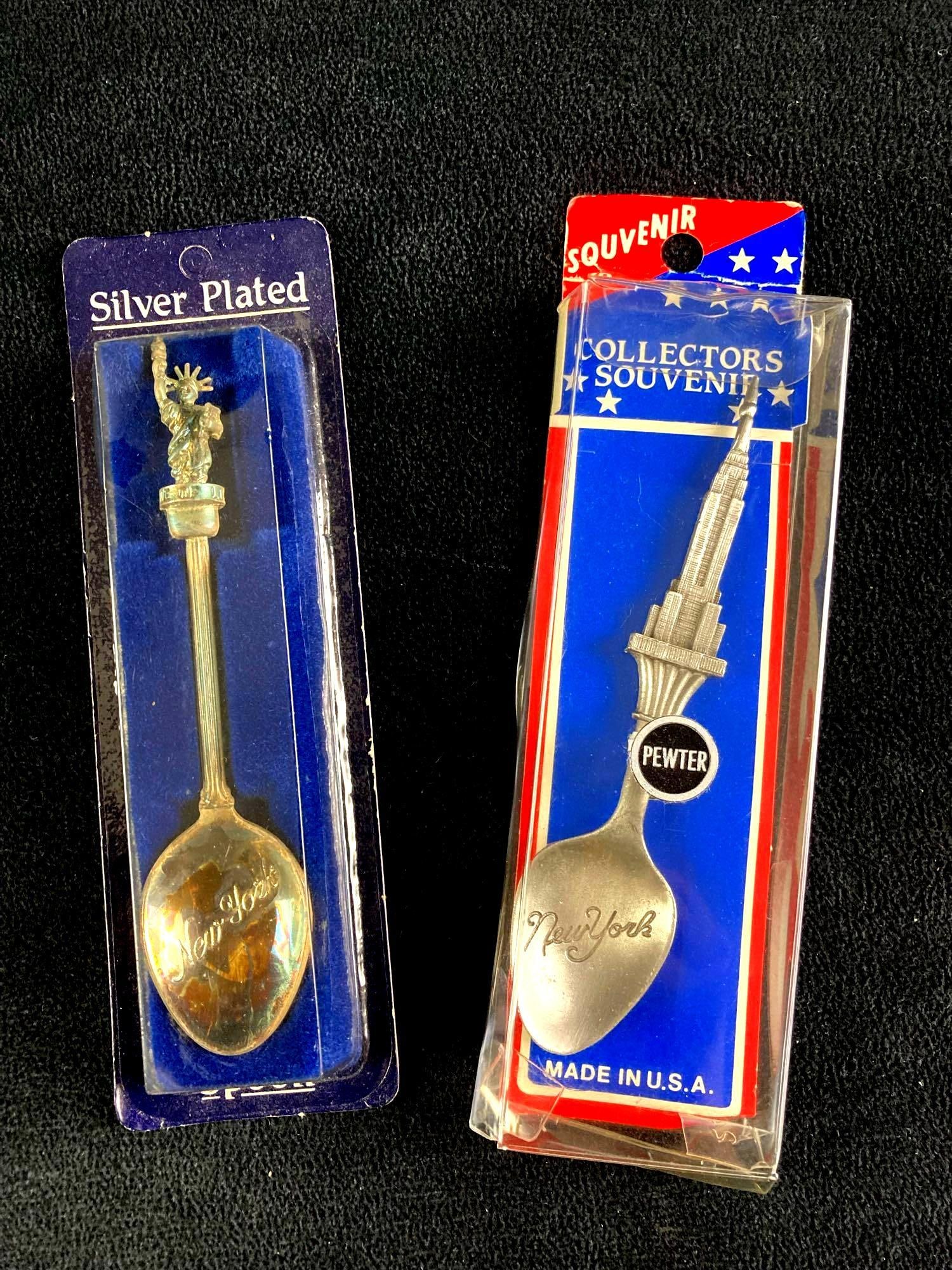 Small Pewter Collectible Spoons: This lot includes: (2) Small Pewter Collectible Spoons Condition is used and see photographs for additional details. The collectible spoons depict New York's land marks, in