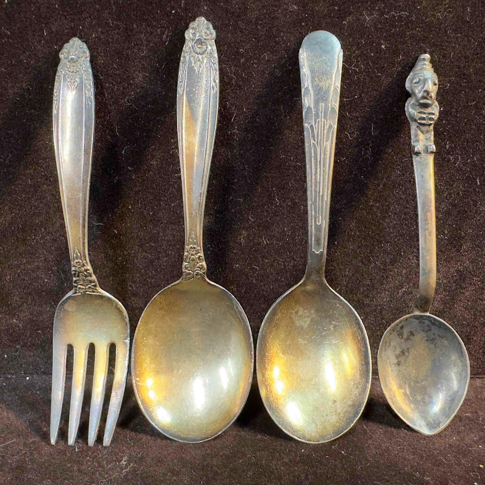 Sterling Silver Silverware Spoon Cocktail Fork Set of 4 Four: Sterling Silver Silverware Spoon Cocktail Fork Set of 4 Four. Each piece has a unique design on the handles. Each piece has various engravings but each has a Sterling engraved marking on the back