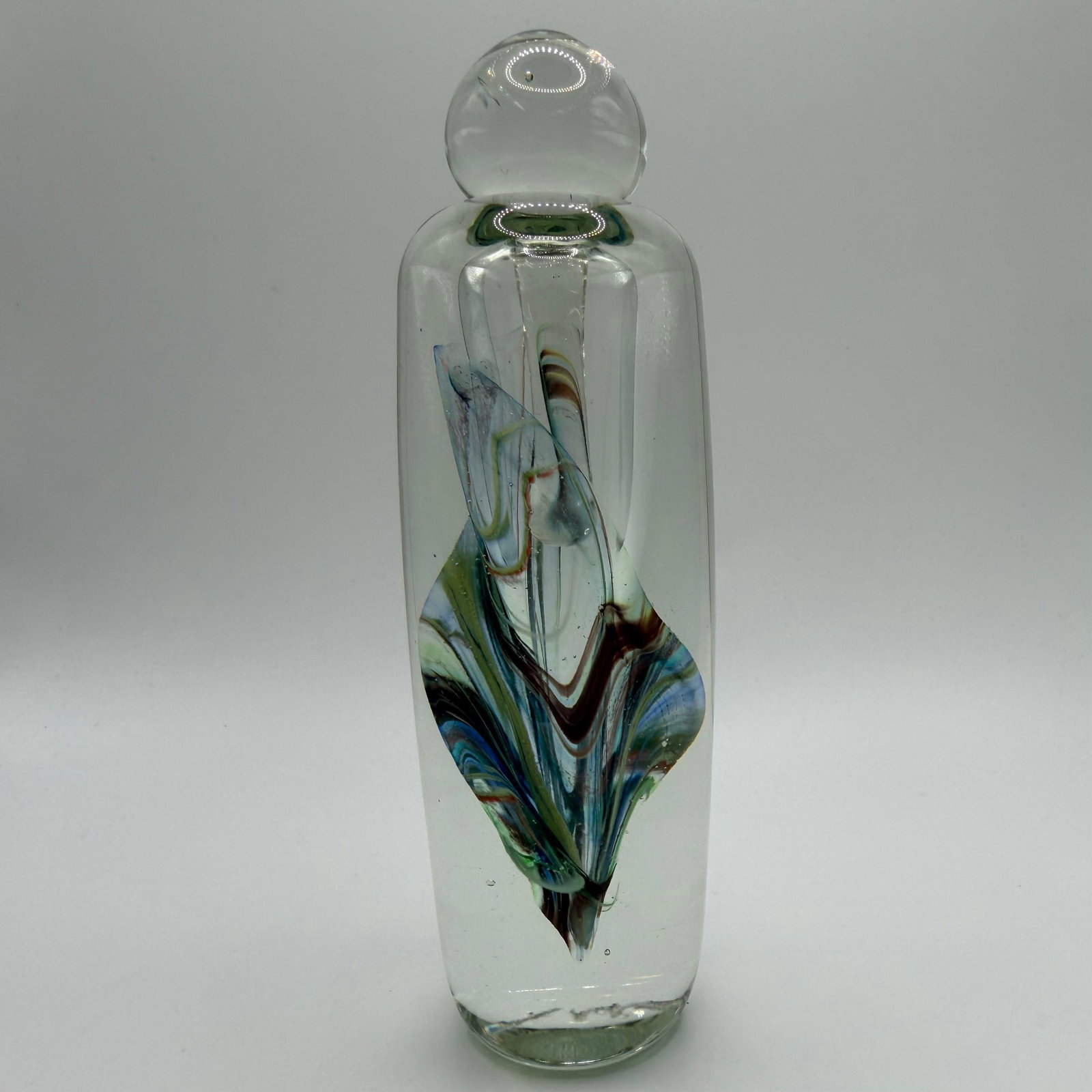 Mid Century Modern Art Glass Perfume Bottle and Stopper Signed Jerusalem Dated: Mid-century modern hand-blown art glass perfume-style bottle with matching stopper, featuring an internal multicolor ribbon swirl design in blue, green, amber, and brown tones, multi-colored. The base