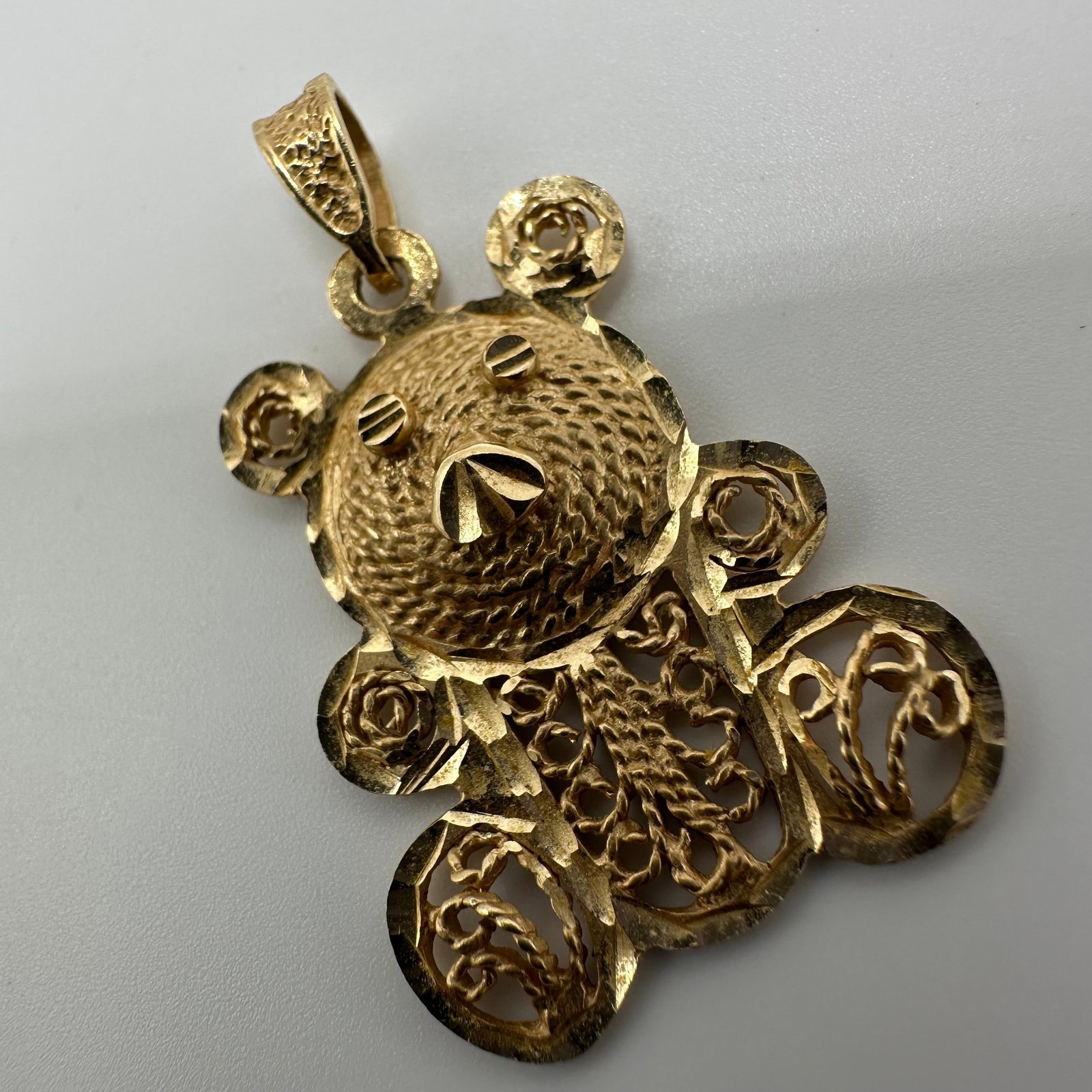 Filigree 14K Yellow Gold Teddy Bear Ornate Pendant: This item is in good pre-owned, previously used/displayed condition with noticeable light wear and surface scratches. Please reference all photos for full details. This piece of jewelry has been teste