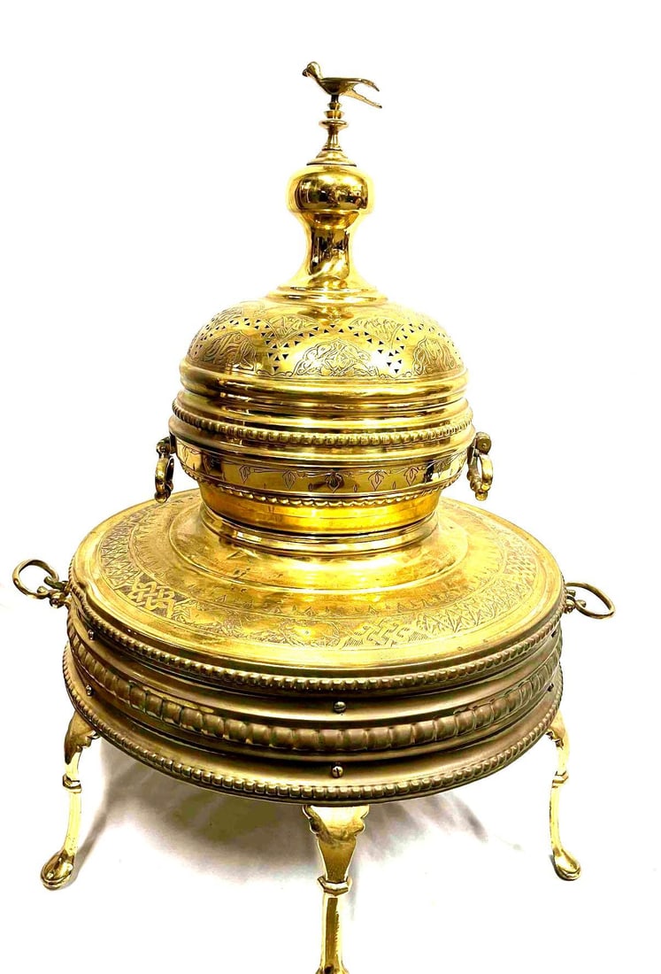 Antique 1900's Ceremonial Brass Brazier Arabic Fire Pit (K30): This lot contains a Antique 1900's Ceremonial Brass Brazier Arabic Fire Pit. The fire pit comes in three pieces. The top is approx 12 1/4" x 12 1/4" x 14 1/4" while the stand is 23 3/4" x 23 3/4"