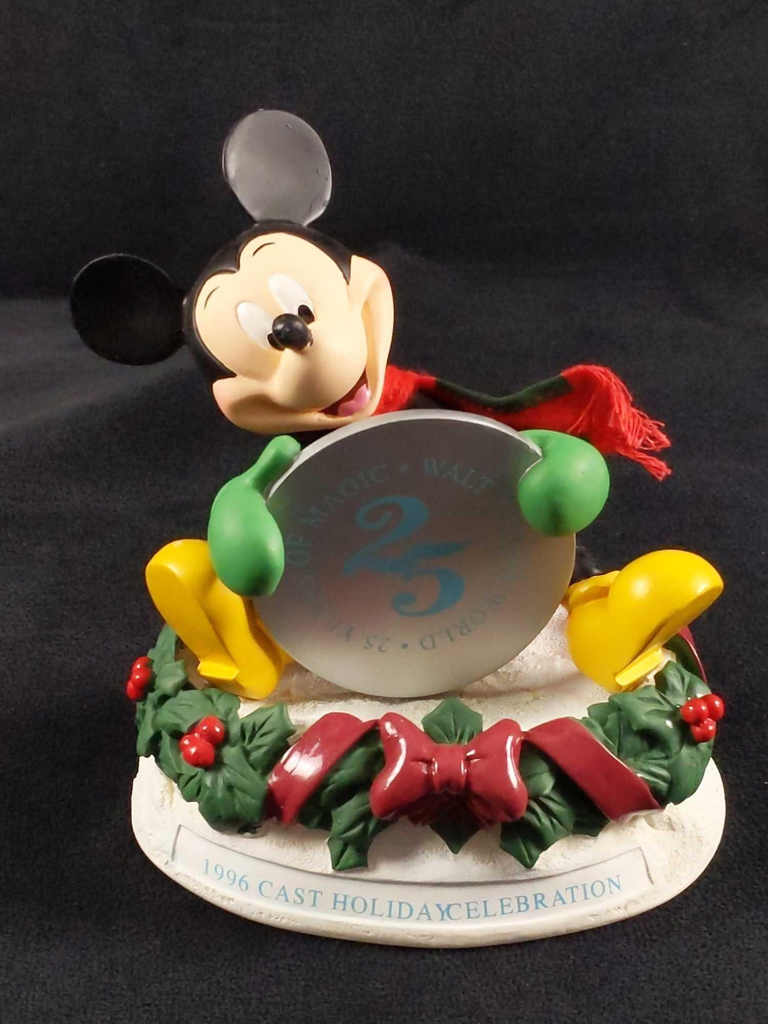 1996 Disney Cast Exclusive Mickey Christmas Figure: Cast member exclusive. Mickey Mouse Walt Disney World 25th Anniversary ceramic figure. Is approx 6" x 4" x 7". Is in good used condition with some markings on Mickey's face and feet. This is also a