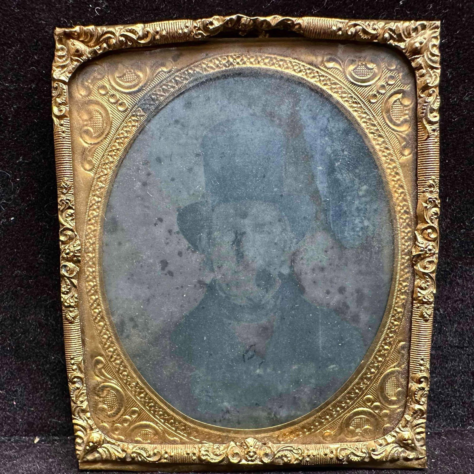 19th Century Style Portrait on Glass of a Gentleman in Top Hat: Antique 19th century portrait on glass photograph featuring a bearded gentleman wearing a tall top hat and formal attire. The image is housed in its original ornate brass mat and frame, showing age-ap
